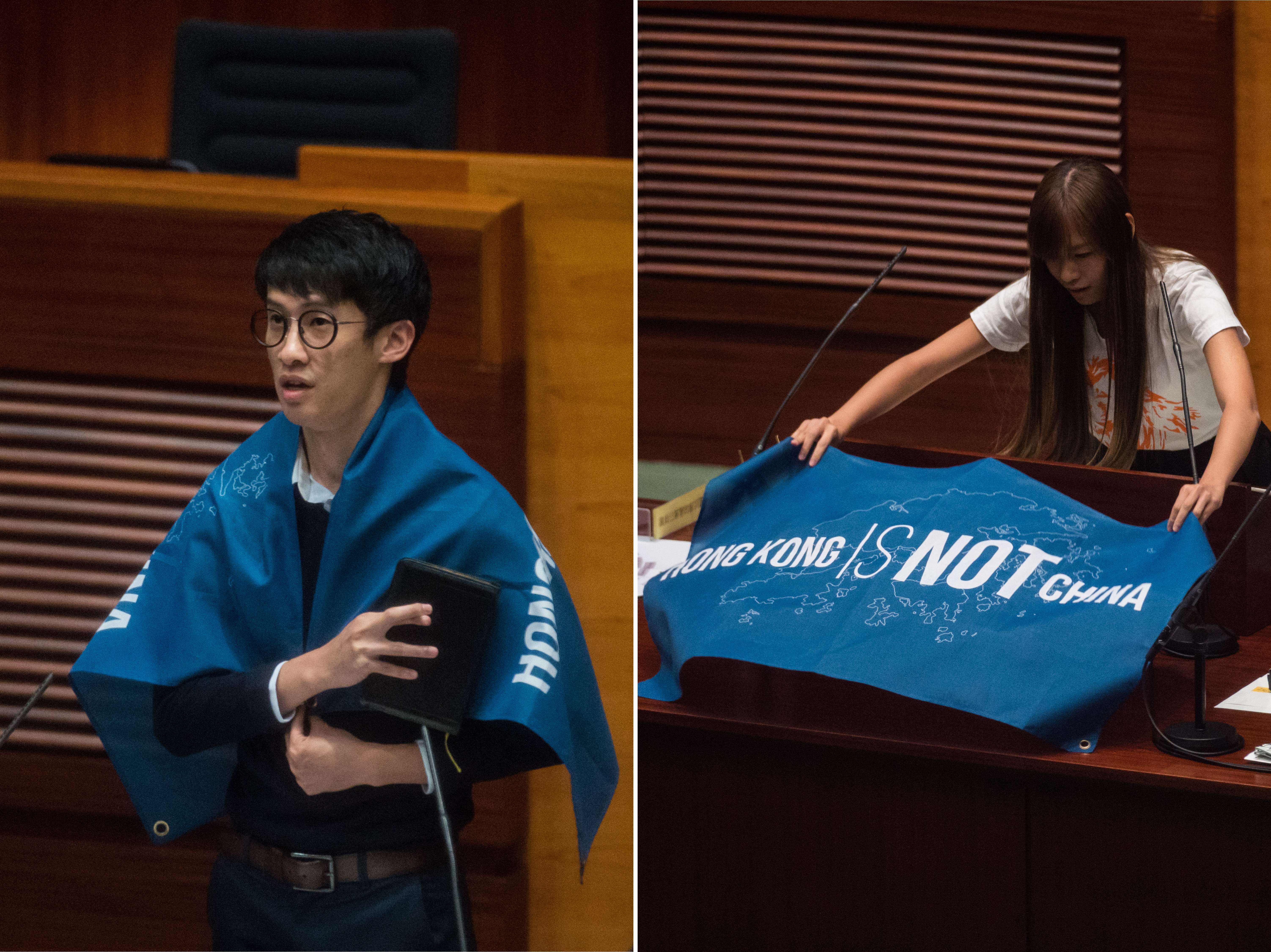 Newly-elected lawmakers Sixtus Baggio Leung and Yau Wai-ching unfurl flags that read "Hong Kong is not China" as they take their Legislative Council oaths. Their actions caused some of their supporters to disavow them. Photo: AFP