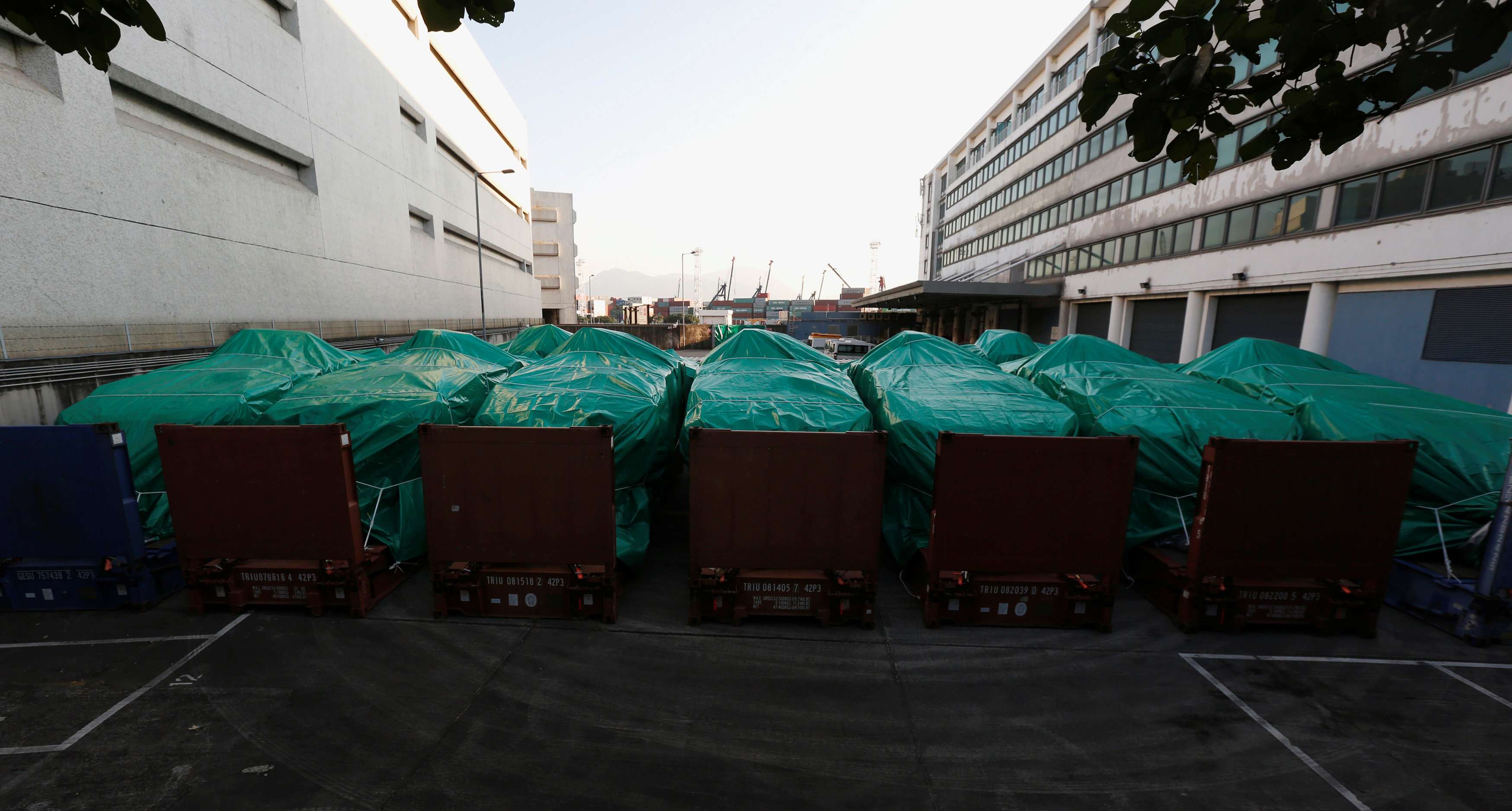 Armoured troop carriers, belonging to Singapore, are detained at a cargo terminal in Hong Kong. Photo: Reuters