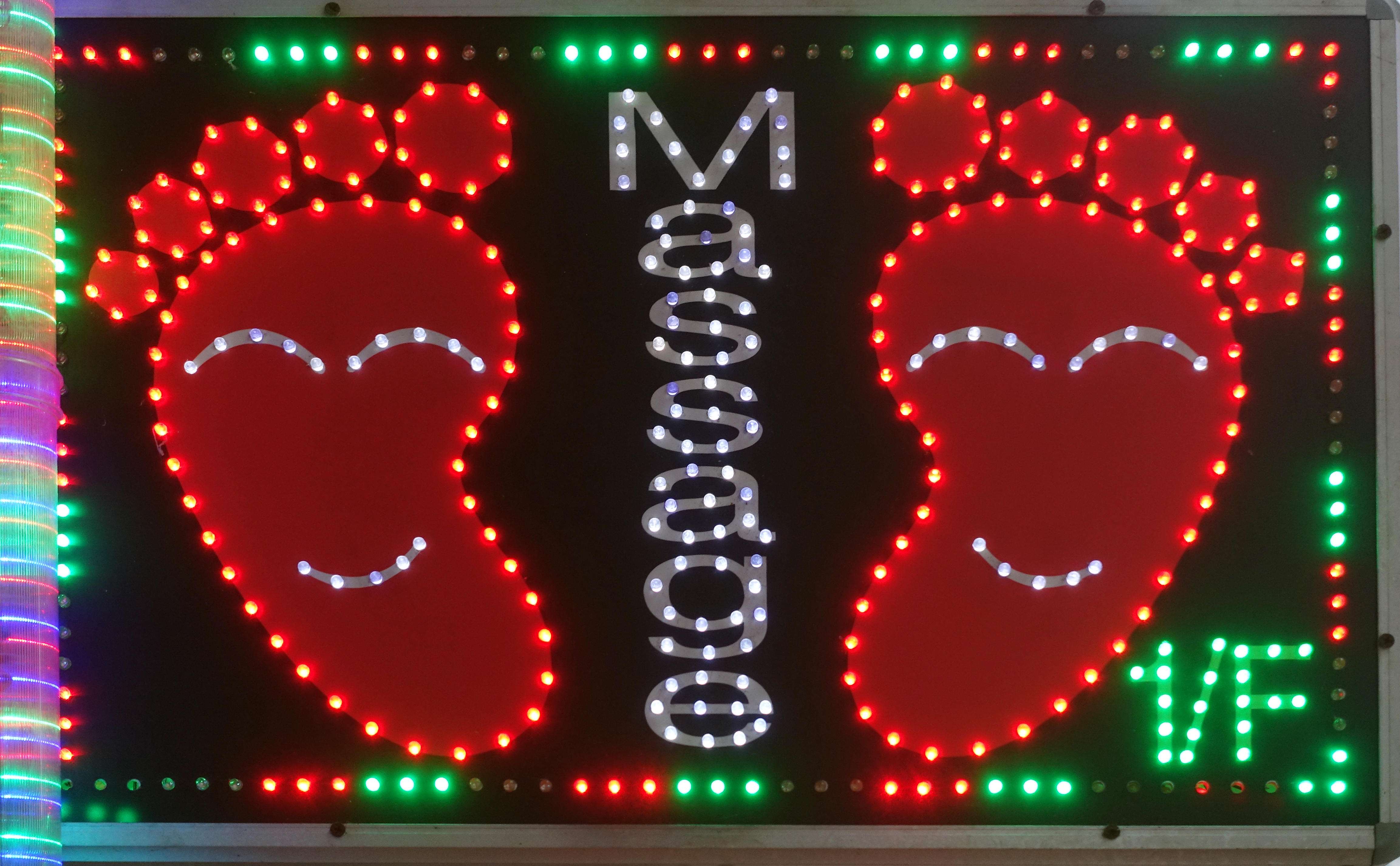 Cheap and cheerful seems to be the message this neon sign for foot massages in Hong Kong is conveying. Photo: Alamy