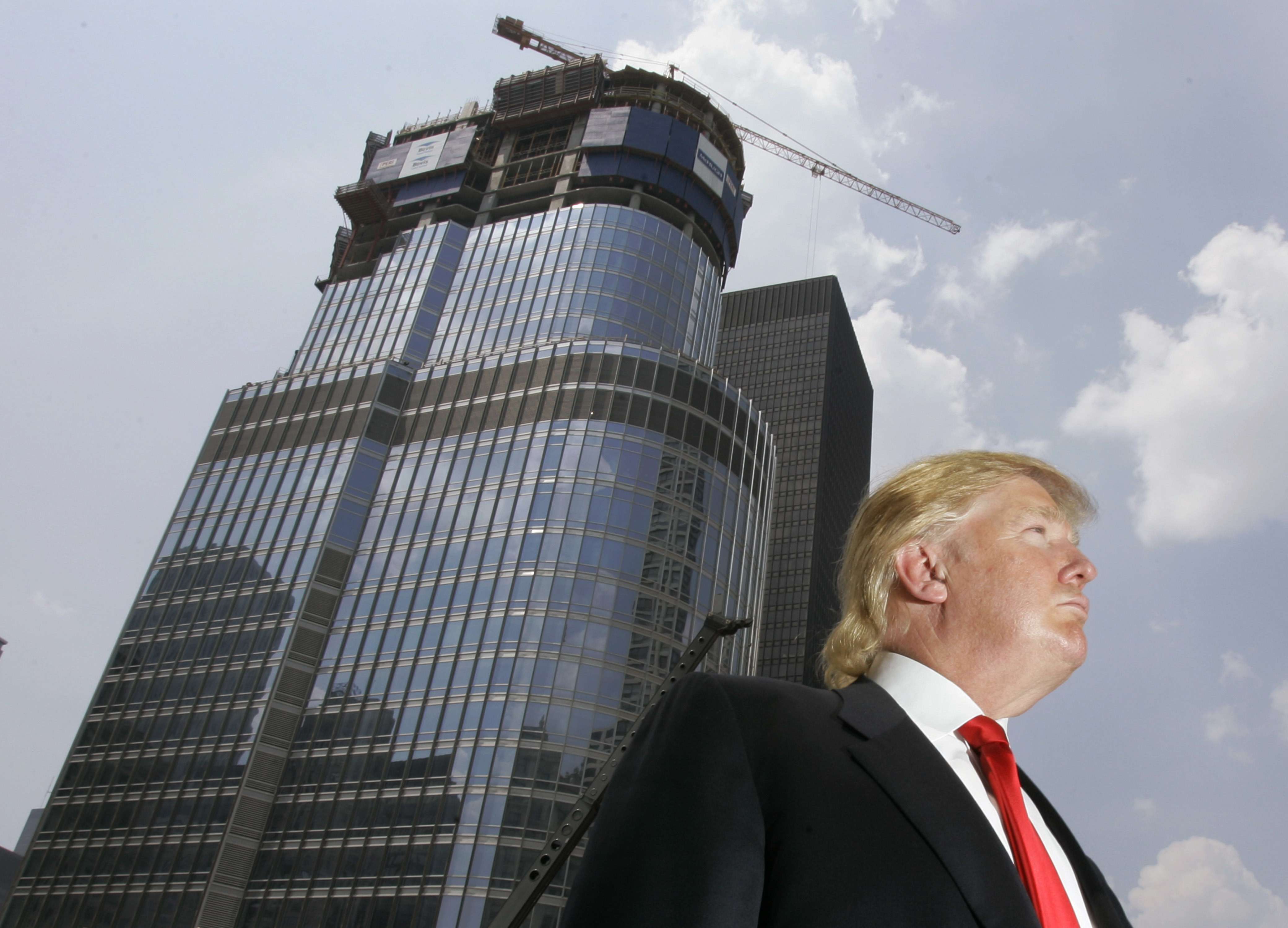 Donald Trump is profiled against his then under construction Trump International Hotel & Tower in Chicago, in this 1997 photo. Many citizens voted for Trump because they saw him as a successful businessman. Photo: AP