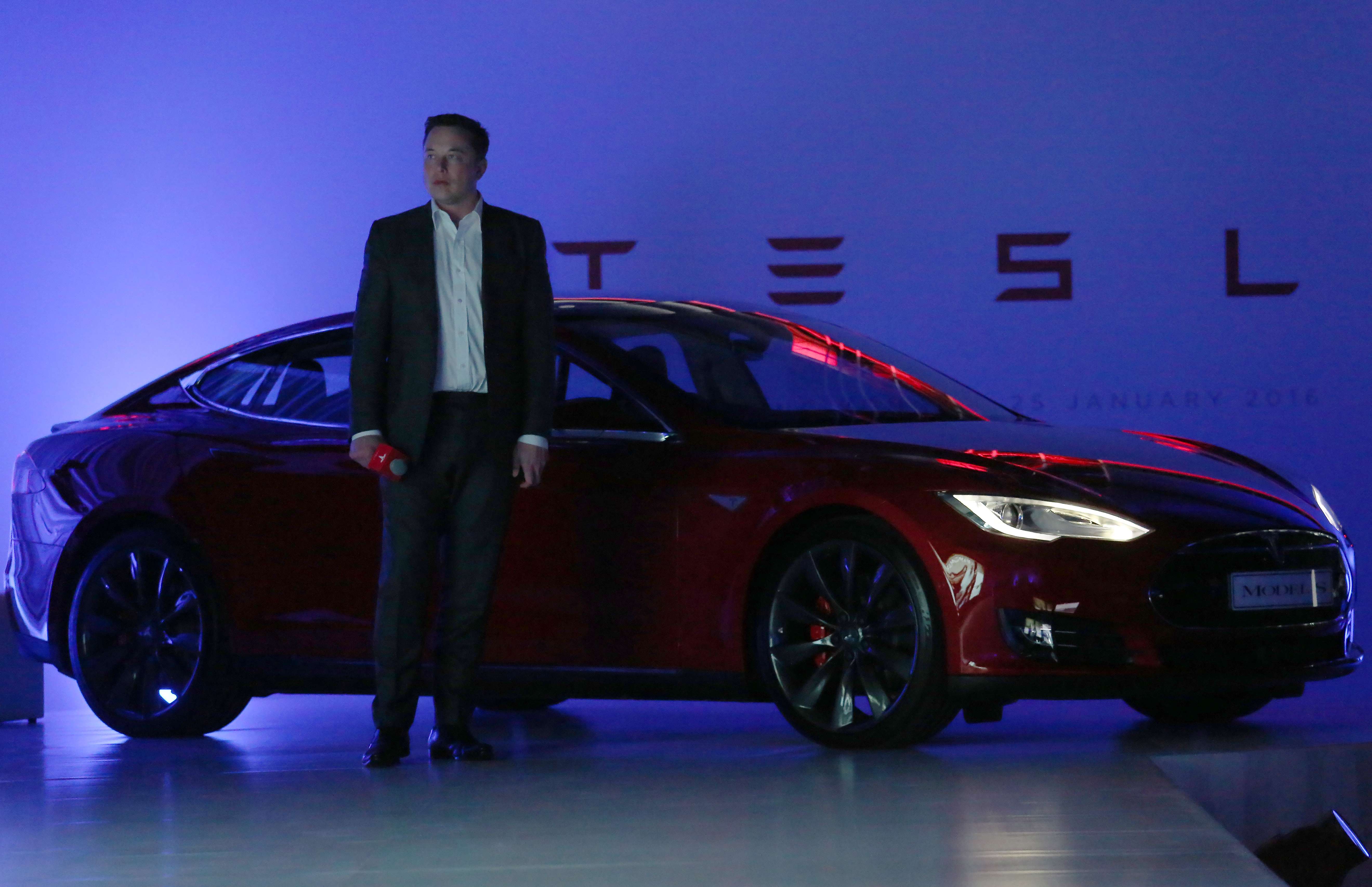 Tesla CEO Elon Musk next to a Model S which, along with the Model X, will receive incremental updates to their autopilot features. Photo: Nora Tam