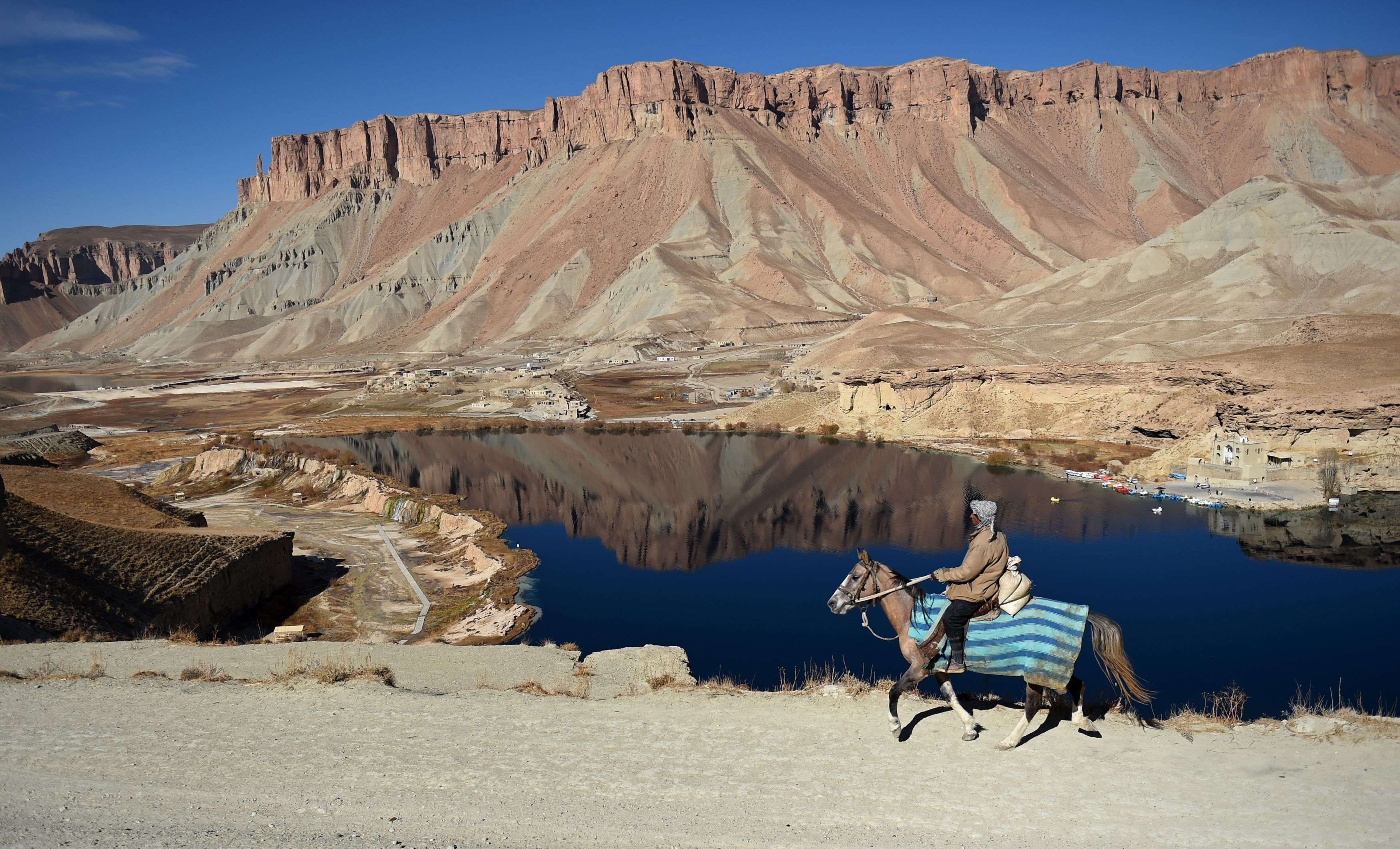 An Afghan man rides a horse past Band-e-Amir lake, in the Bamiyan valley, a key node in the Silk Road that once linked China with Central Asia and beyond. China’s belt and road can take its inspiration from not only the old Silk Road, but also a successor closer to our time. Photo: AFP