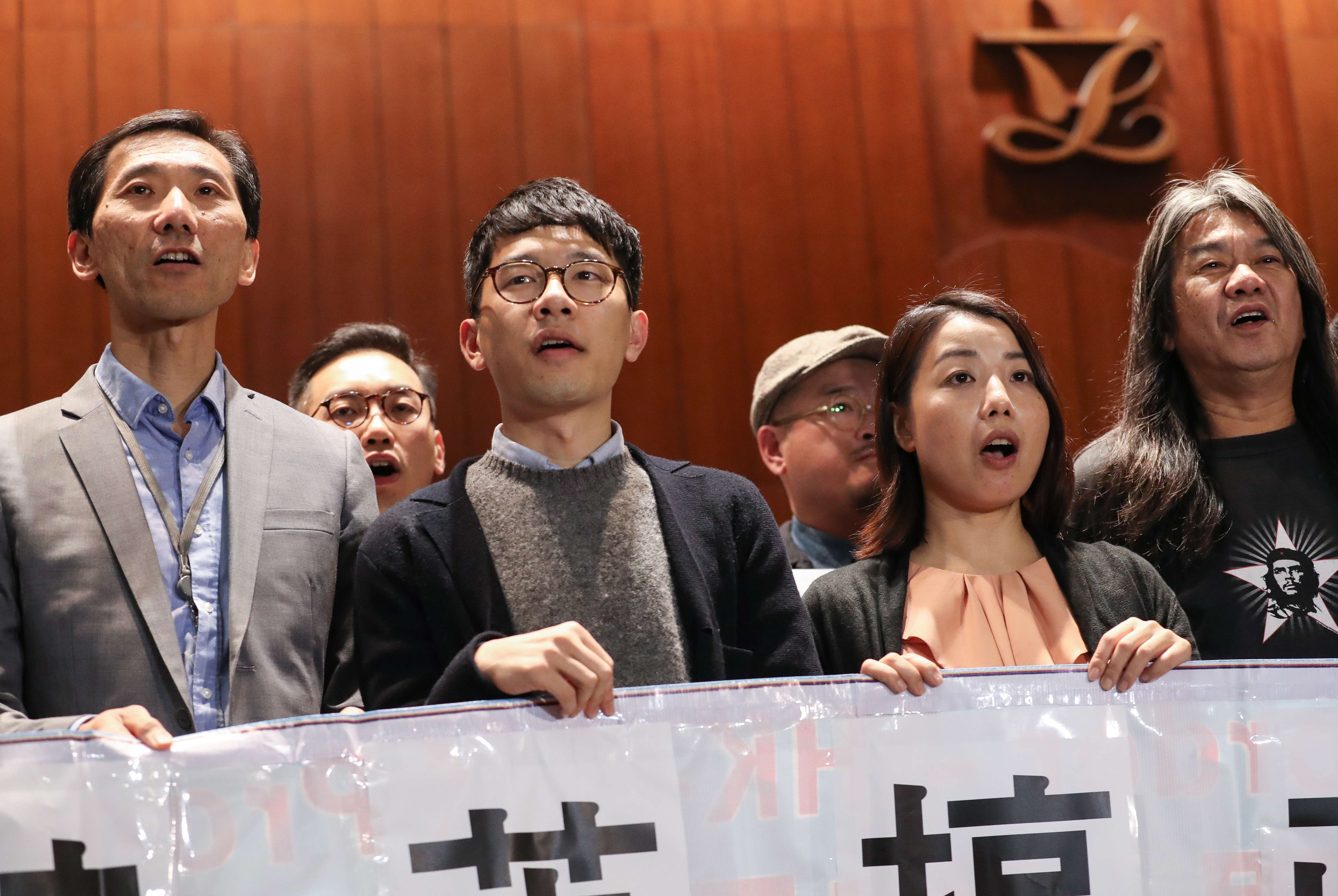 Lawmakers (from left) Edward Yiu, Nathan Law, Lau Siu-lai and Leung Kwok-hung protest against Chief Executive Leung Chun-ying outside the Legislative Council on December 2 after the government filed judicial writs to disqualify them over improper oath-taking. Photo: Nora Tam