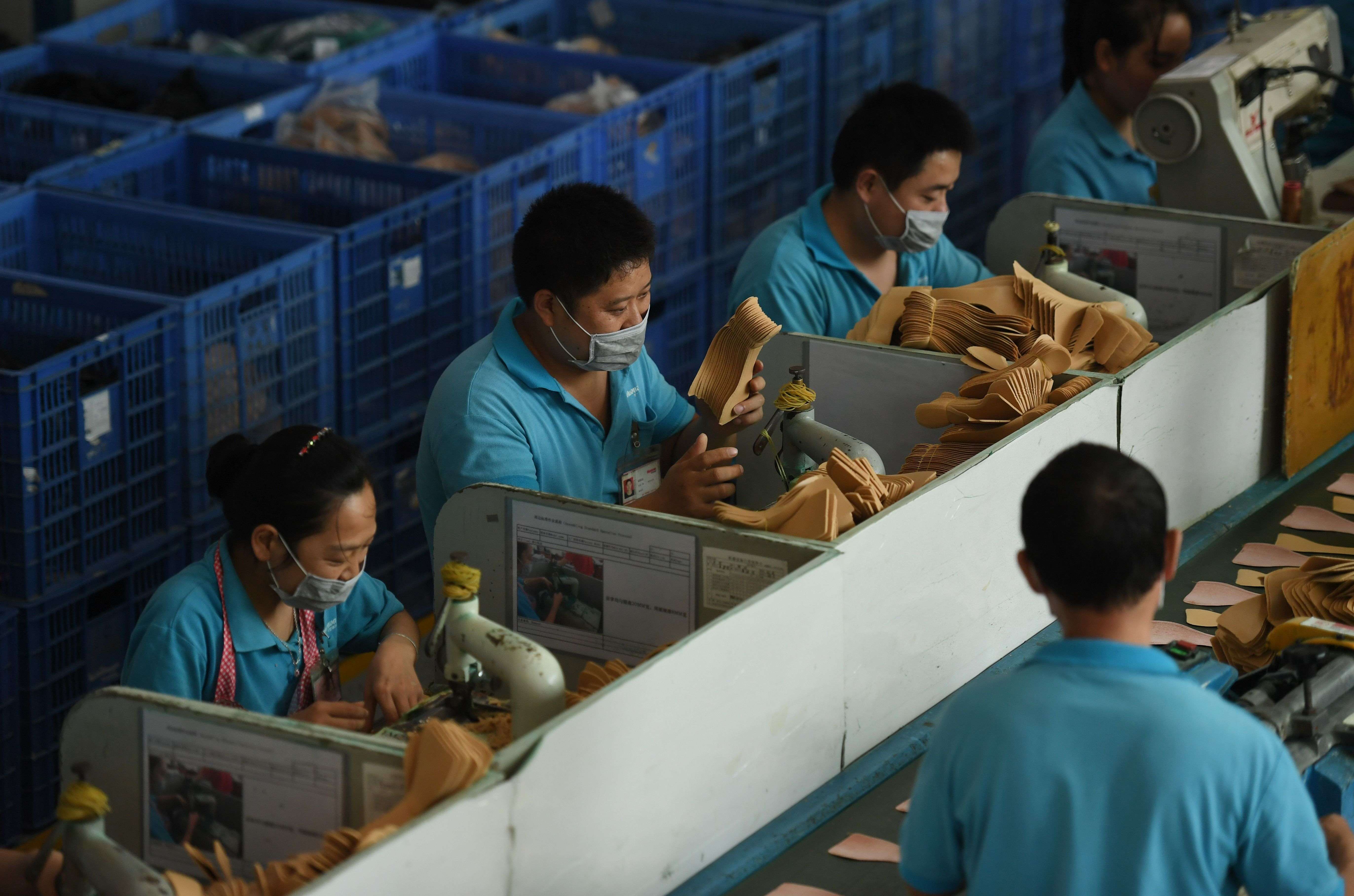 Workers on a production line at a shoe factory in Dongguan, Guangdong province, in September. With the huge supply of cheap labour now petering out, the focus is on innovation and increased productivity. Photo: AFP