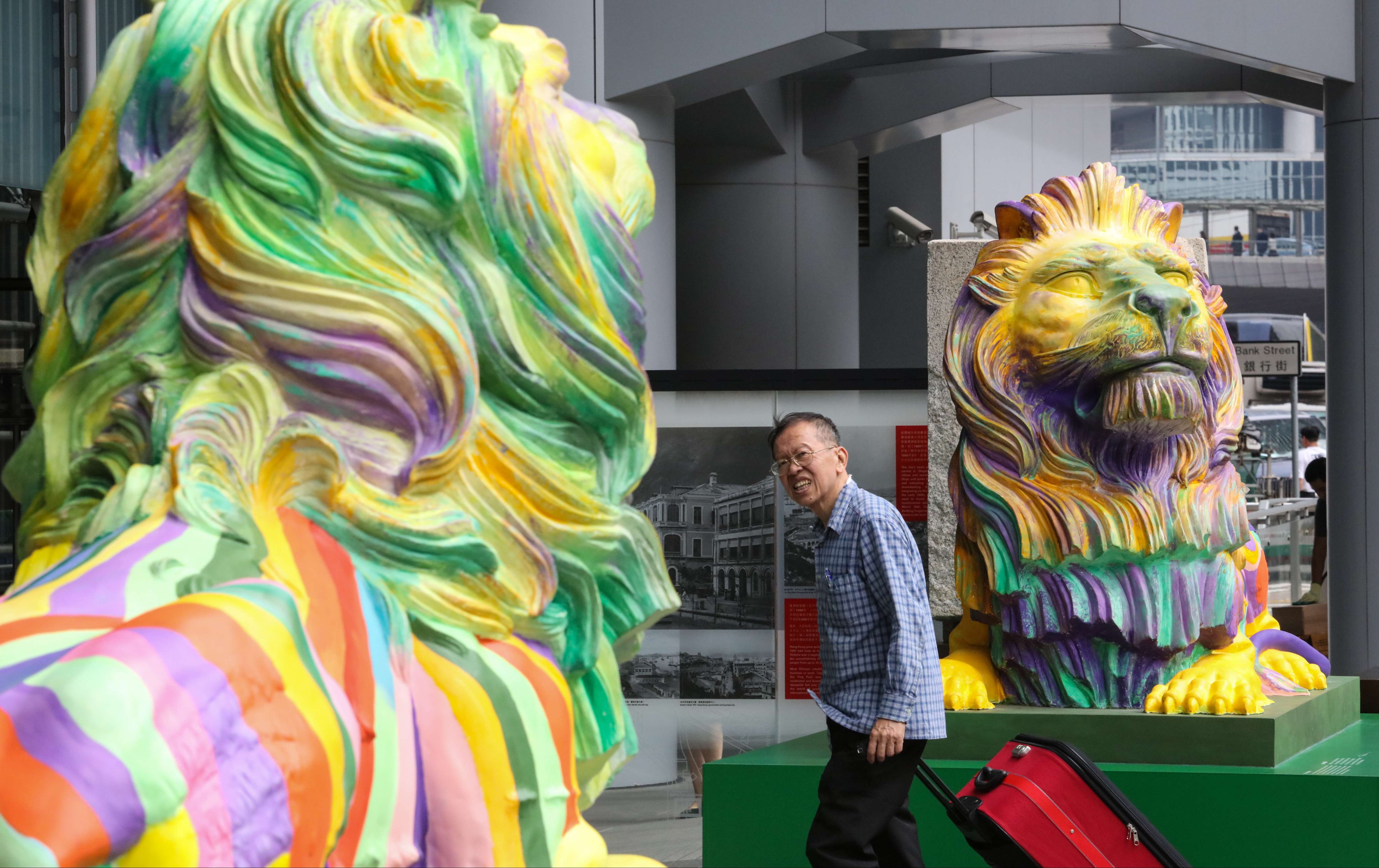 The rainbow-coloured lions outside HSBC headquarters in Central, created by LGBT artist Michael Lam, represent pride and unity in diversity. Photo: Felix Wong