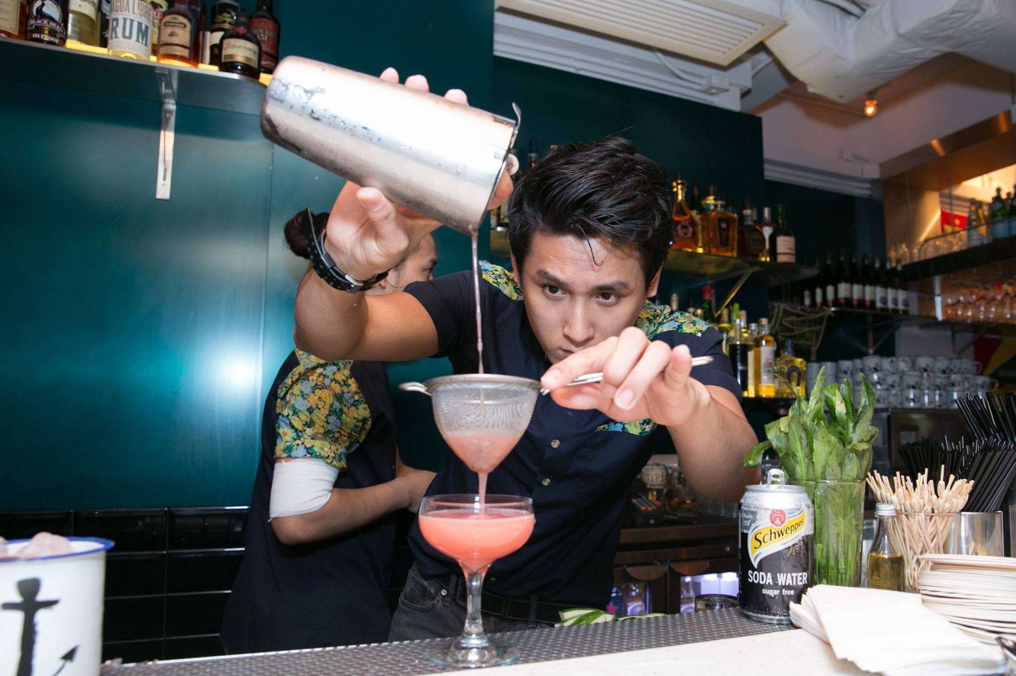 A bartender mixes drinks at Rummin' Tings on Hollywood Road in Central.