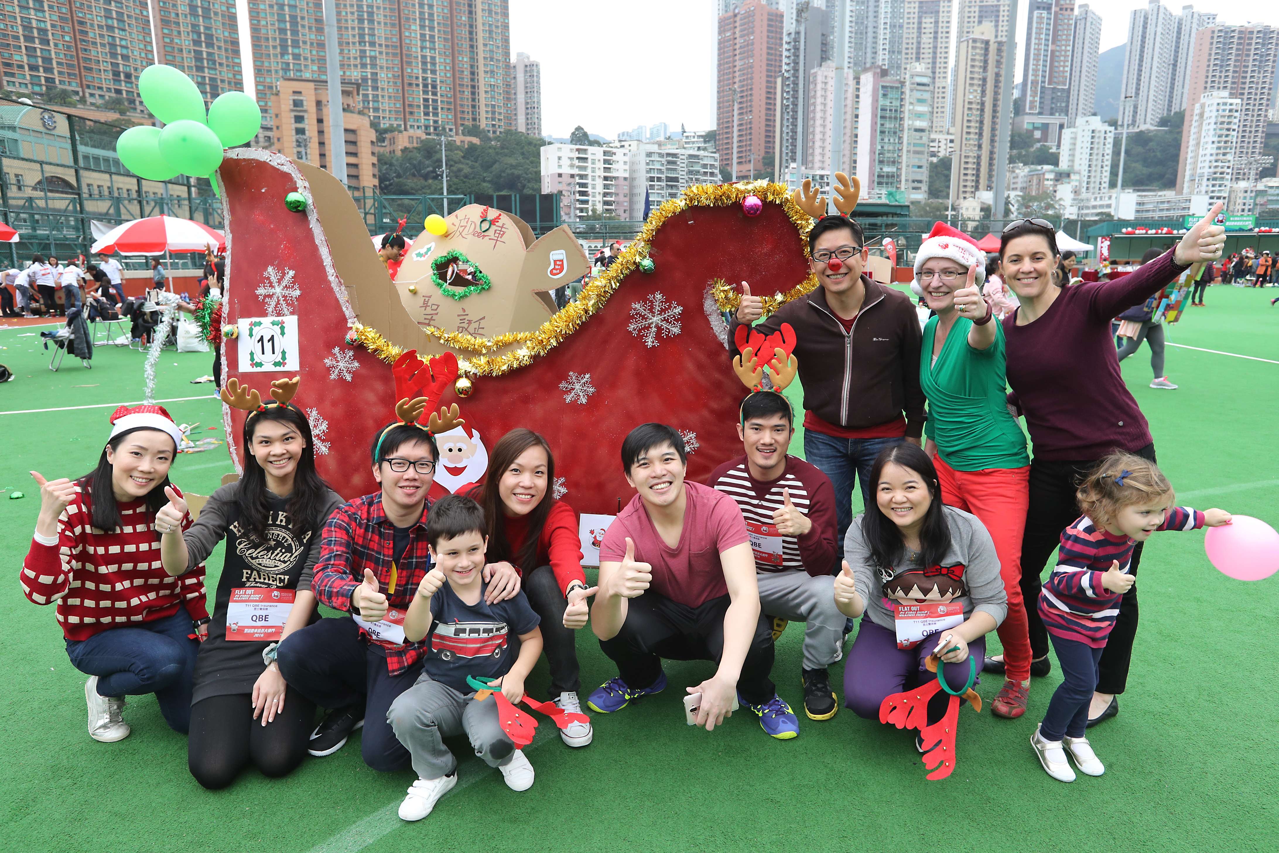 Company employees and children at an Operation Santa Claus event in Happy Valley in December. Photo: Edward Wong