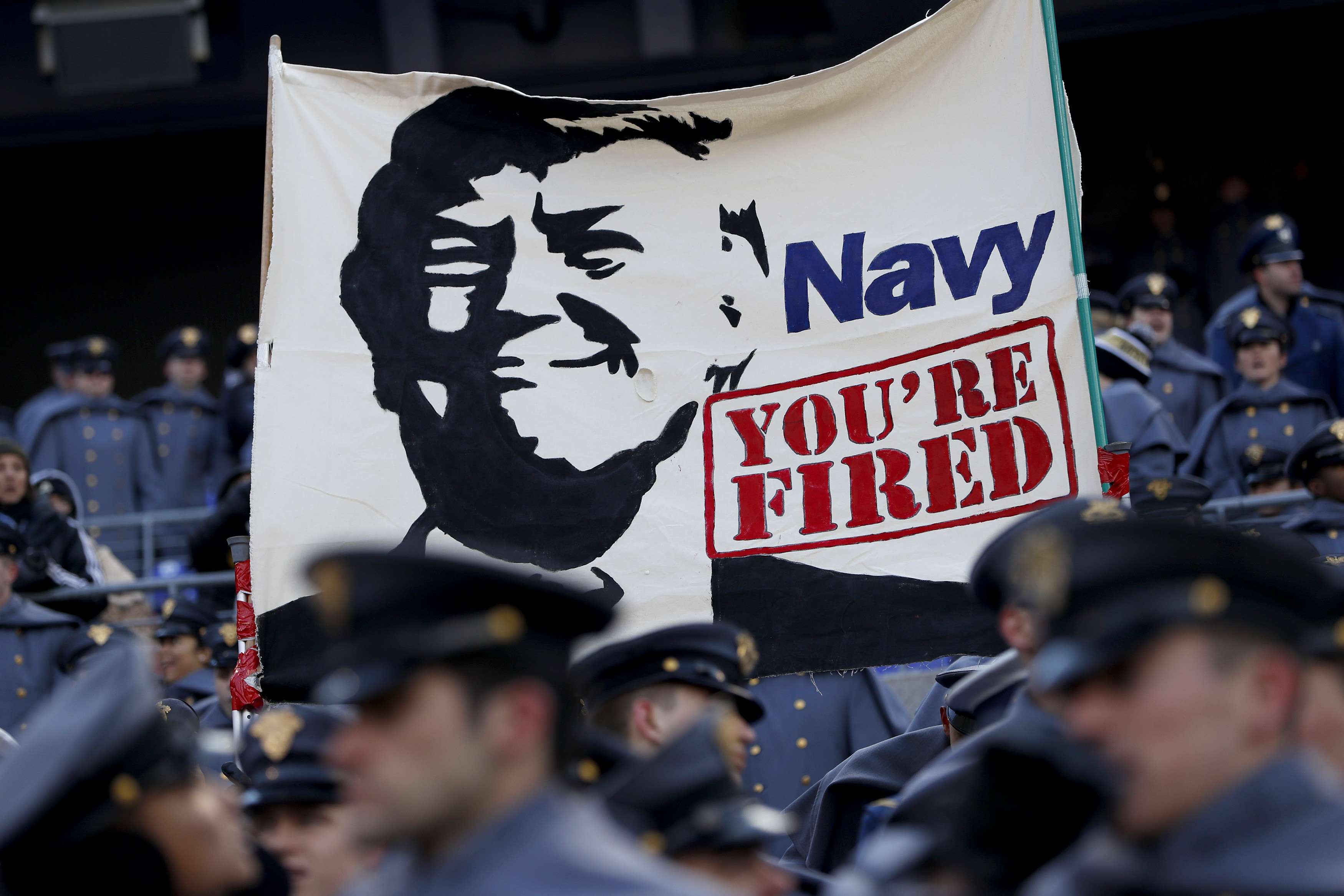 Cadets from the US Military Academy fly a banner depicting Donald Trump prior to the game between the Navy Midshipmen and the Army Black Nights at M&T Bank Stadium in Baltimore, Maryland. Photo: AFP