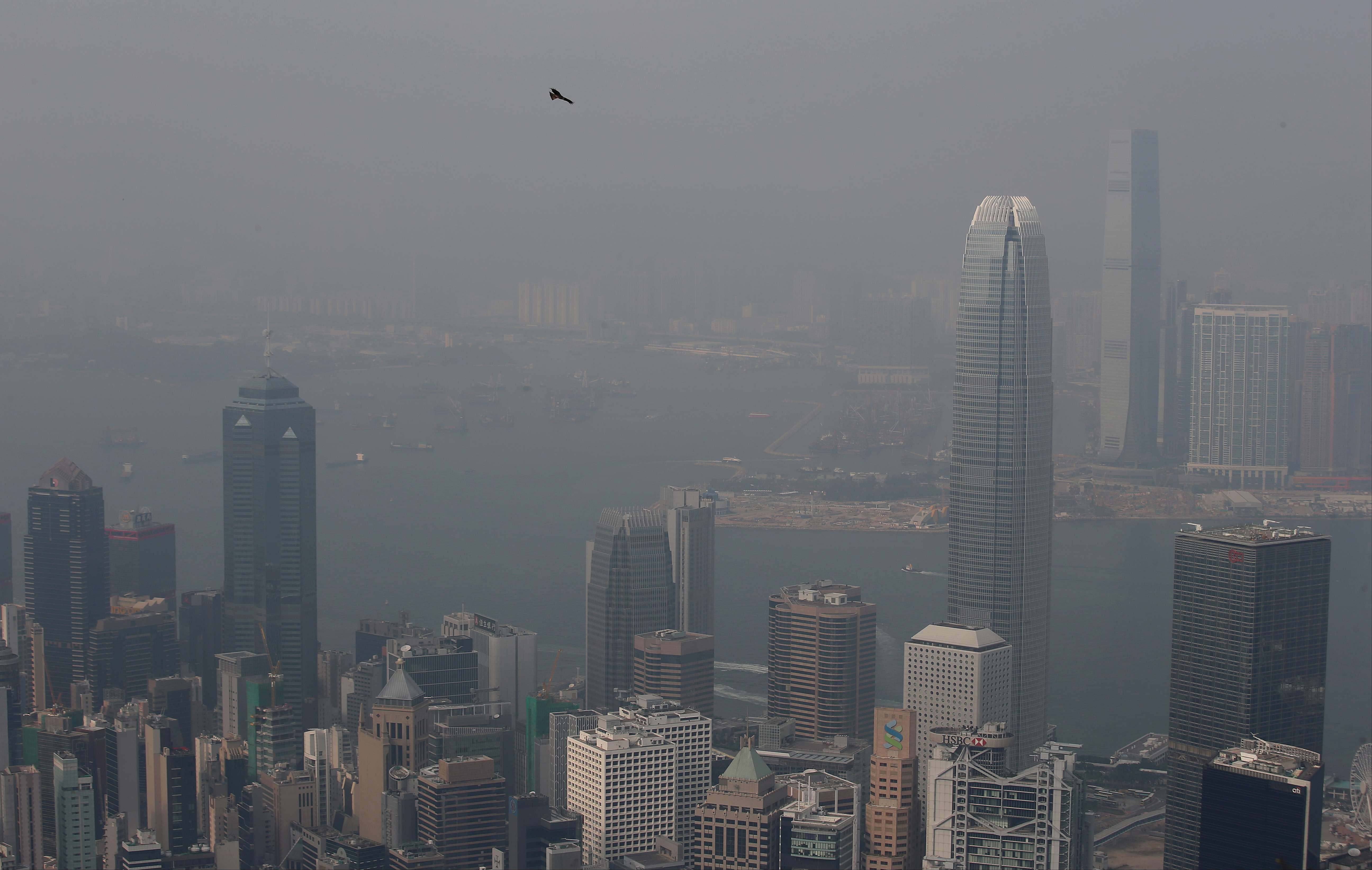 Haze blankets iconic buildings along Hong Kong’s Victoria harbour on January 8. Photo: David Wong