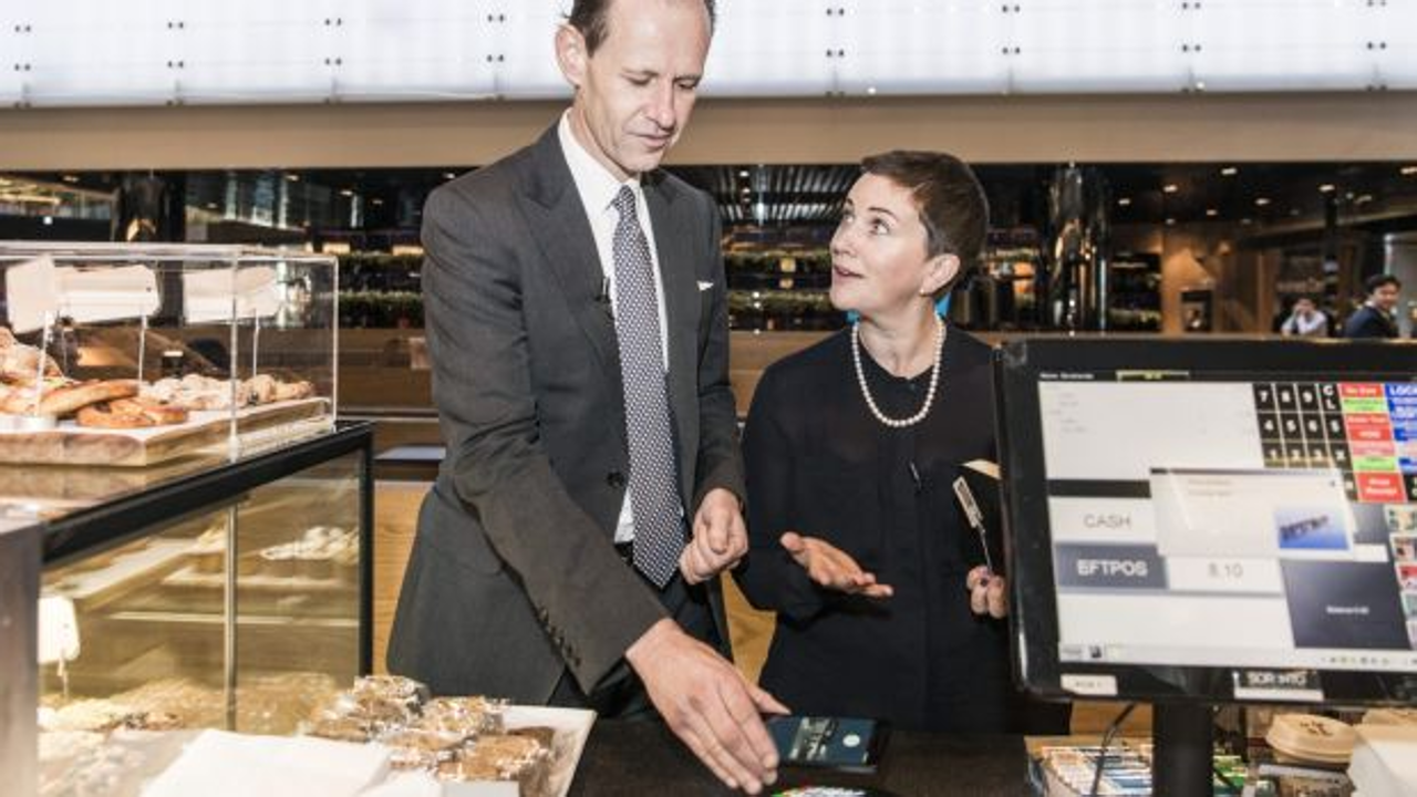 ANZ Bank chief executive Shayne Elliott tries out Android Pay, alongside managing director of products, Katherine Bray. Photo: ANZ