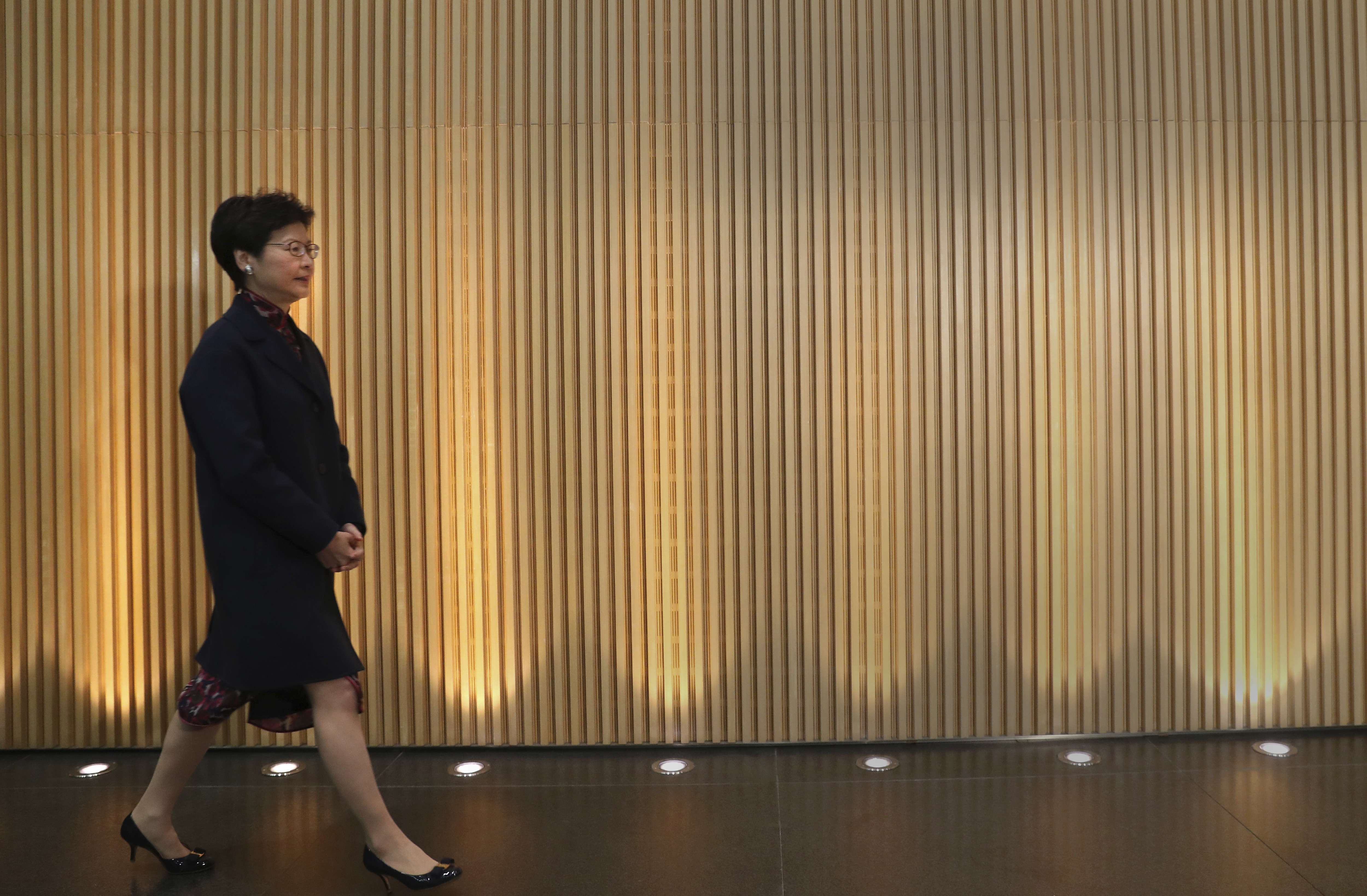 Carrie Lam arrives at a press conference at the government headquarters to announce her resignation in Hong Kong. Photo: AP