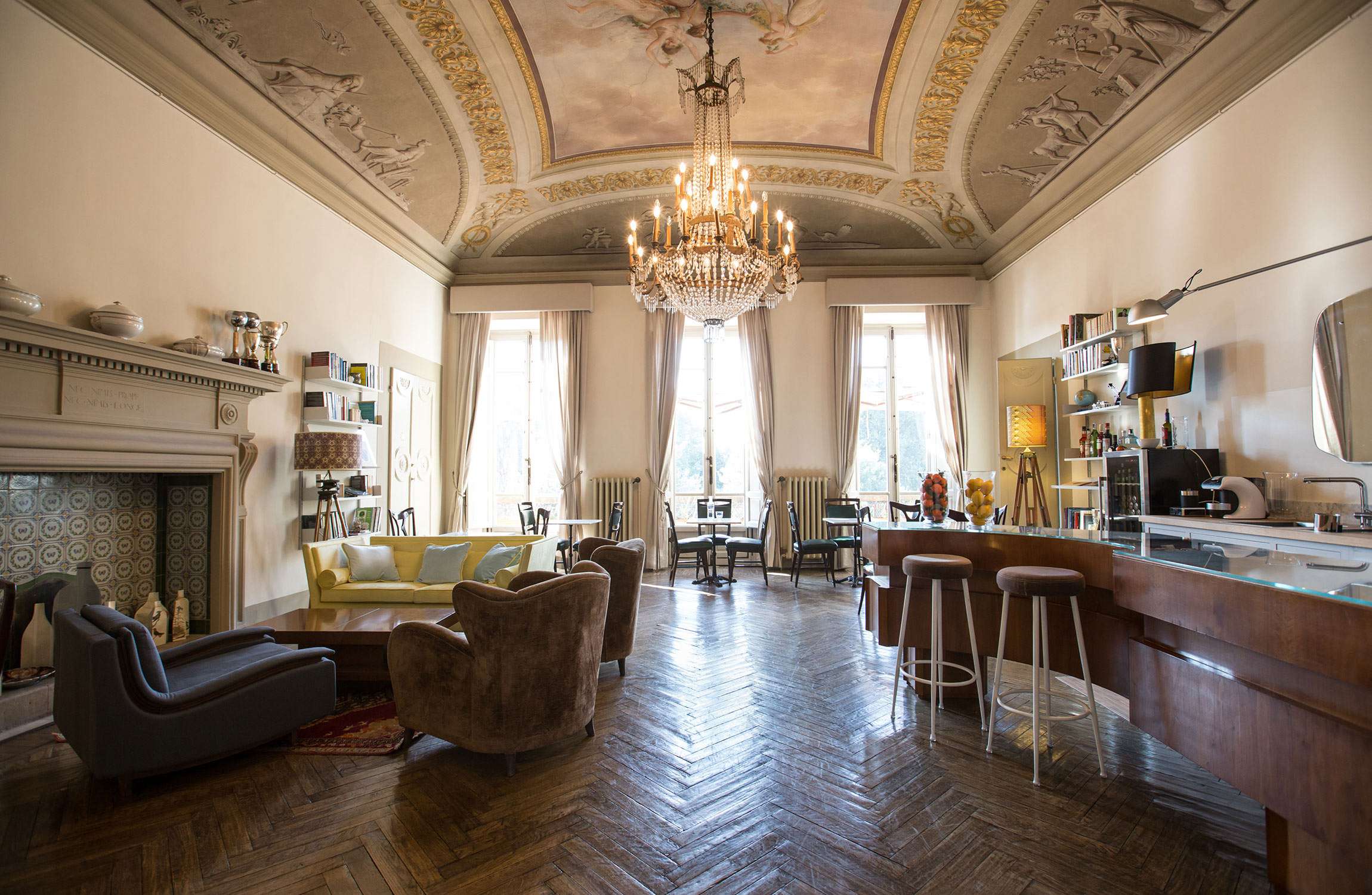The high-ceilinged living room of the AdAstra, in Florence.