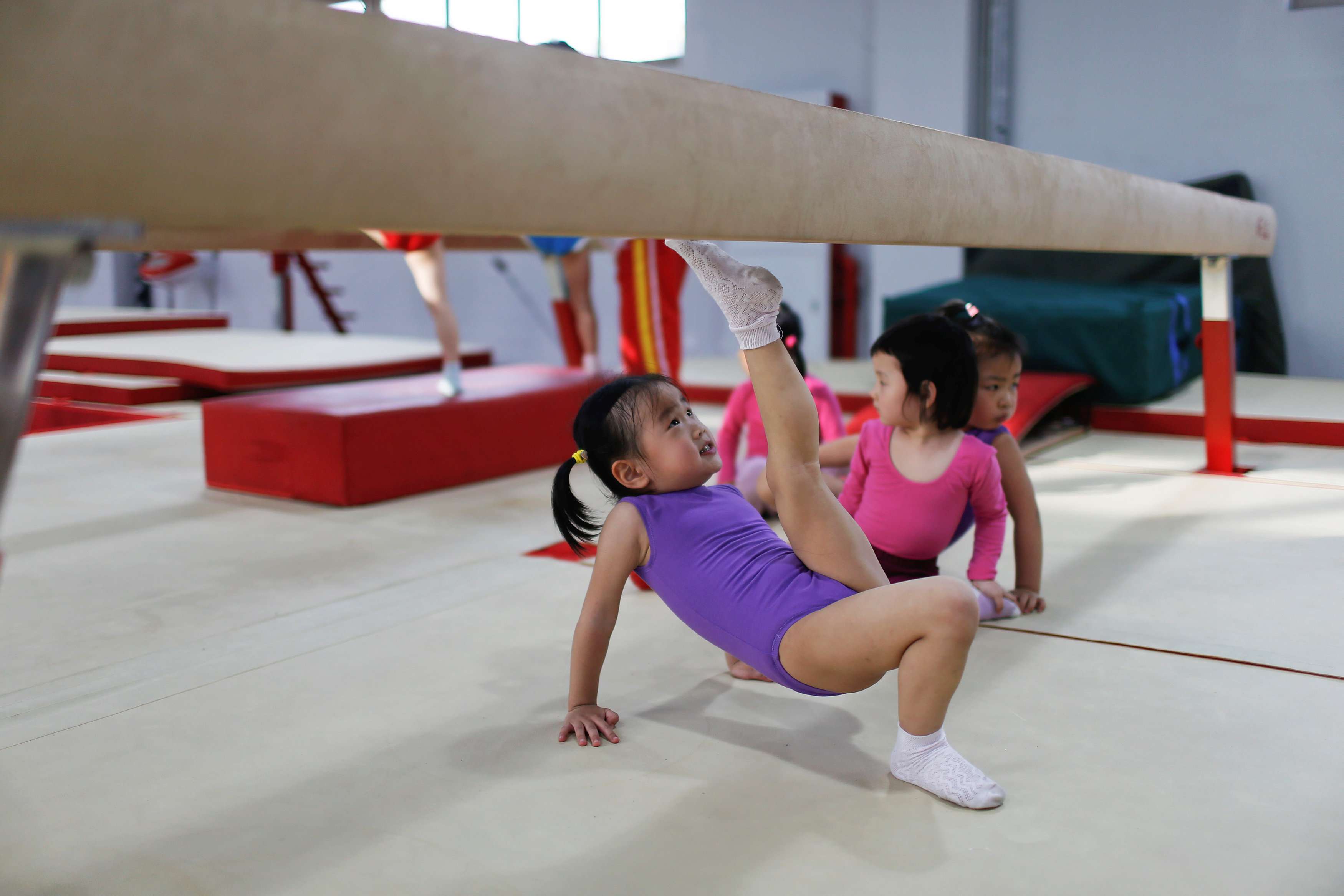 Young gymnasts practise their routines at the Shanghai Yangpu Youth Amateur Athletic School last May. Photo: Reuters