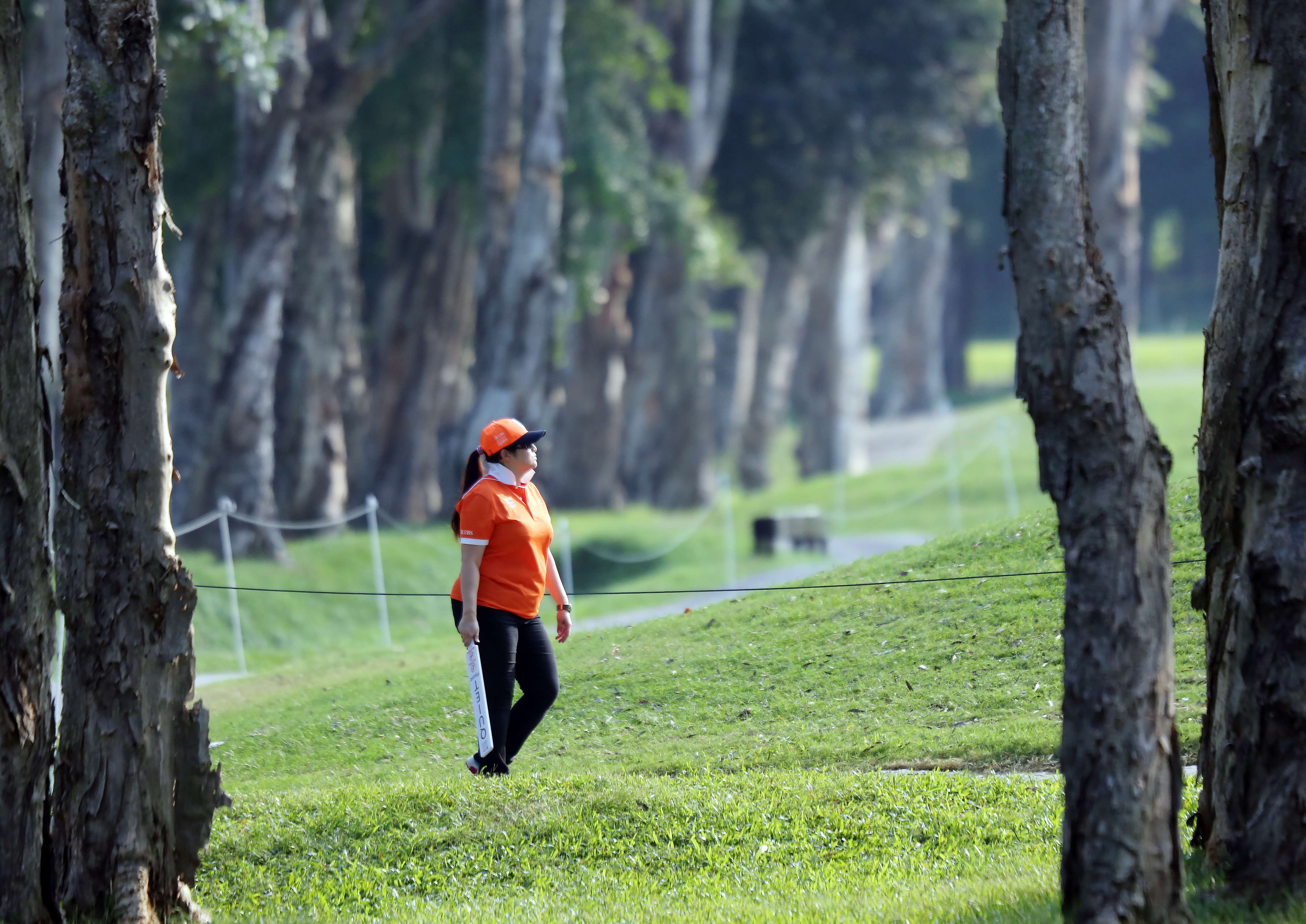 A staff member walks around the Fanling course during the Hong Kong Open golf tournament in 2015. Photo: Edward Wong