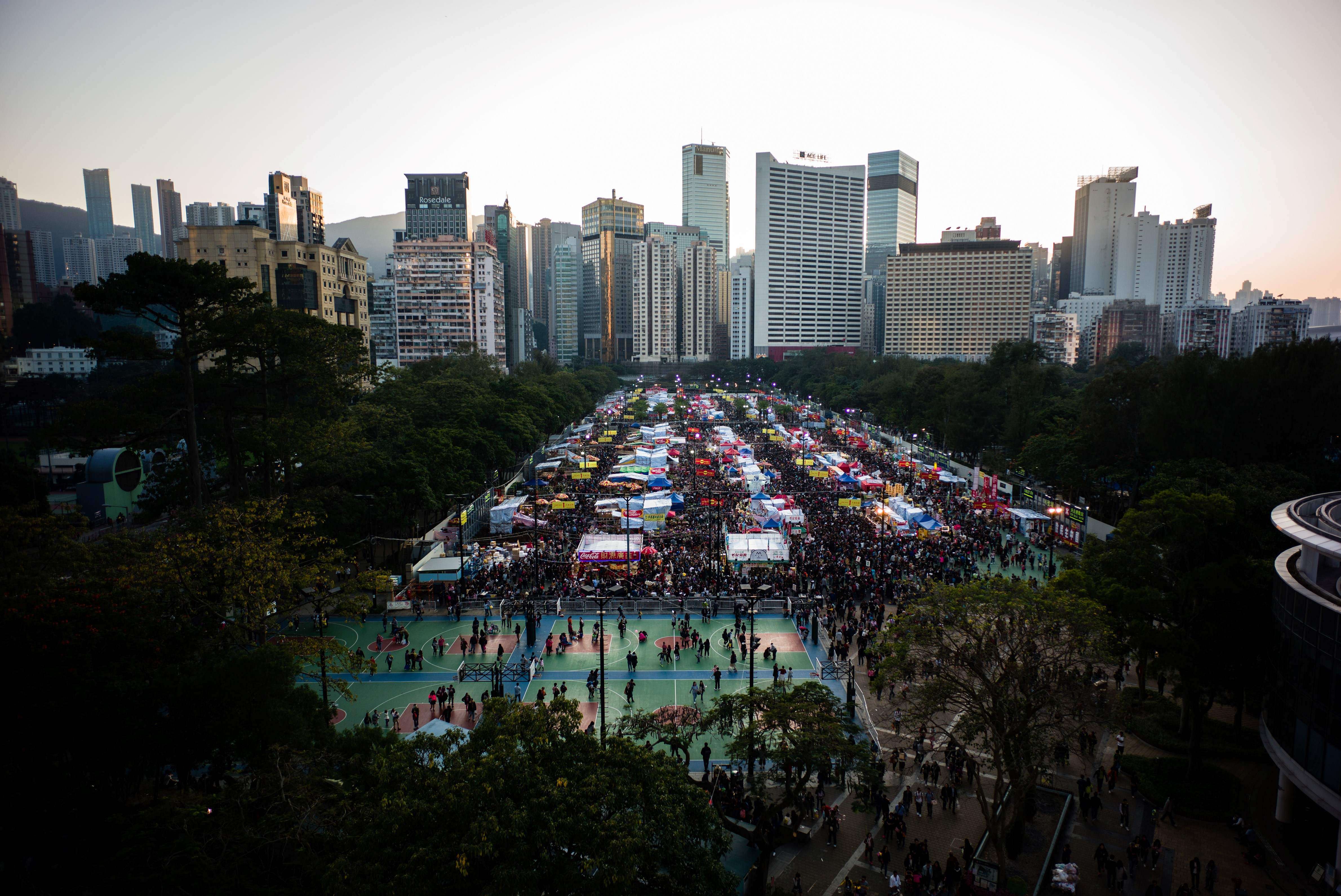 Hong Kong people throng the Victoria Park New Year flower market on January 27, on the eve of the Lunar New Year holiday. Victoria Park already offers a comfortable pedestrian path network and an abundance of sports and recreational facilities. Photo: AFP