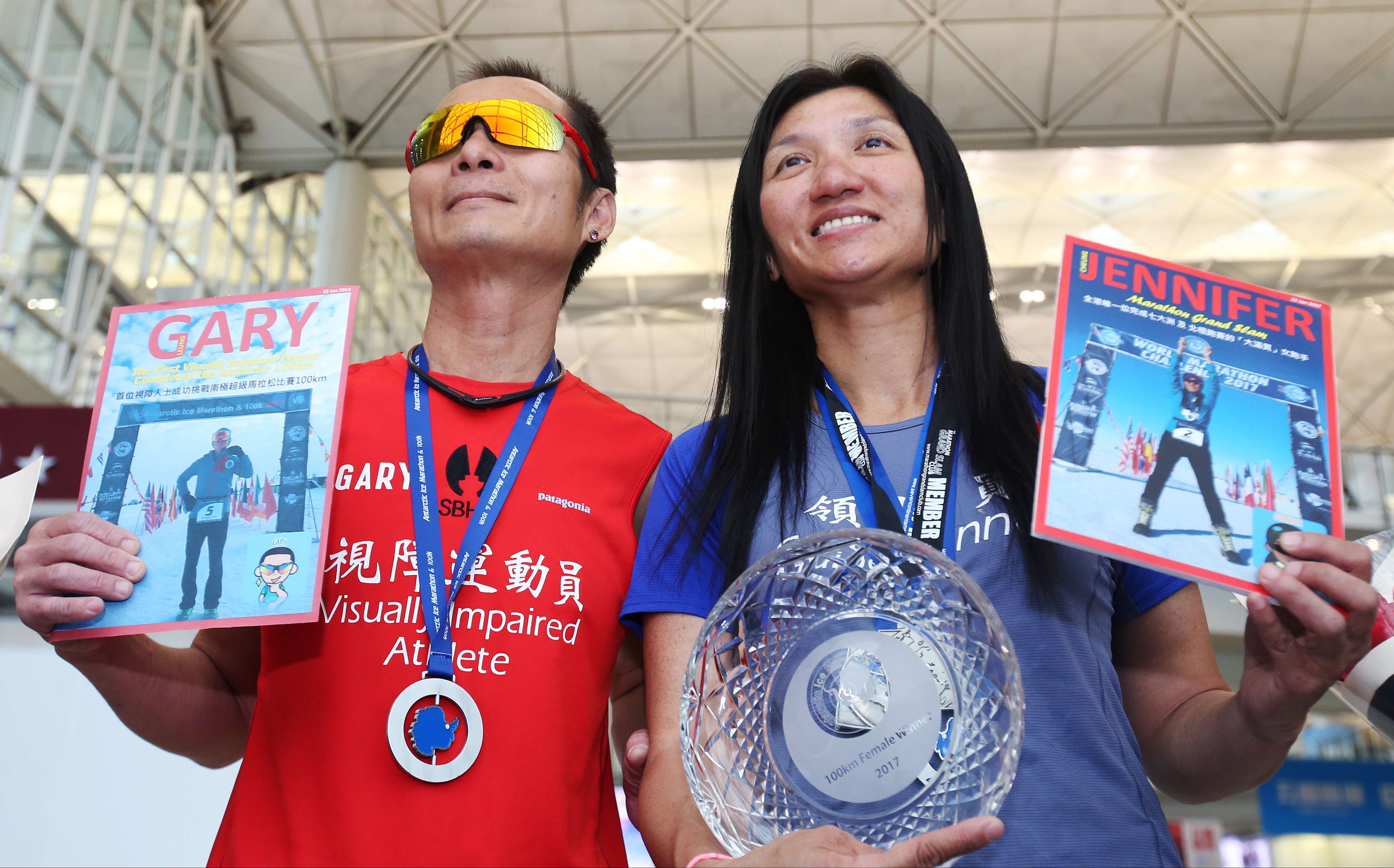 Visually impaired athlete Gary Leung Siu-wai and running partner Jennifer Cheung Sze-ying at Hong Kong international airport after Leung became the first visually impaired athlete to complete a special 100km race in the South Pole, on January 30. The pair took part in the super race, a part of the World Marathon Challenge 2017, to raise funds for Samaritan Befrienders Hong Kong. Photo: David Wong