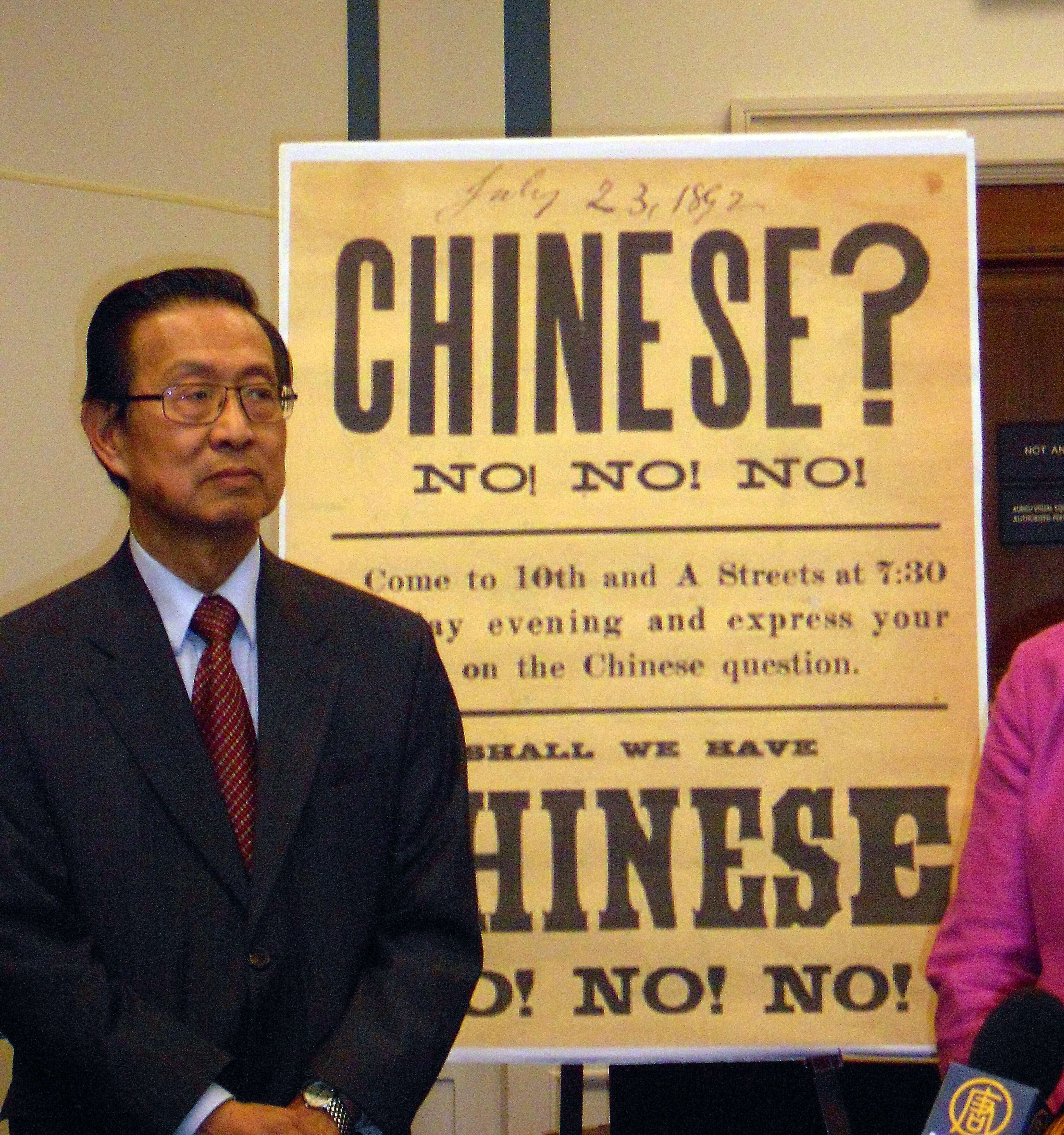 Michael Lin, chair of the 1882 Project, in front of a 19th century sign. The 1882 project was formed to push for an official statement of regret over the Chinese Exclusion Act. Congress passed a motion to “express regret” in 2012. Photo: AFP