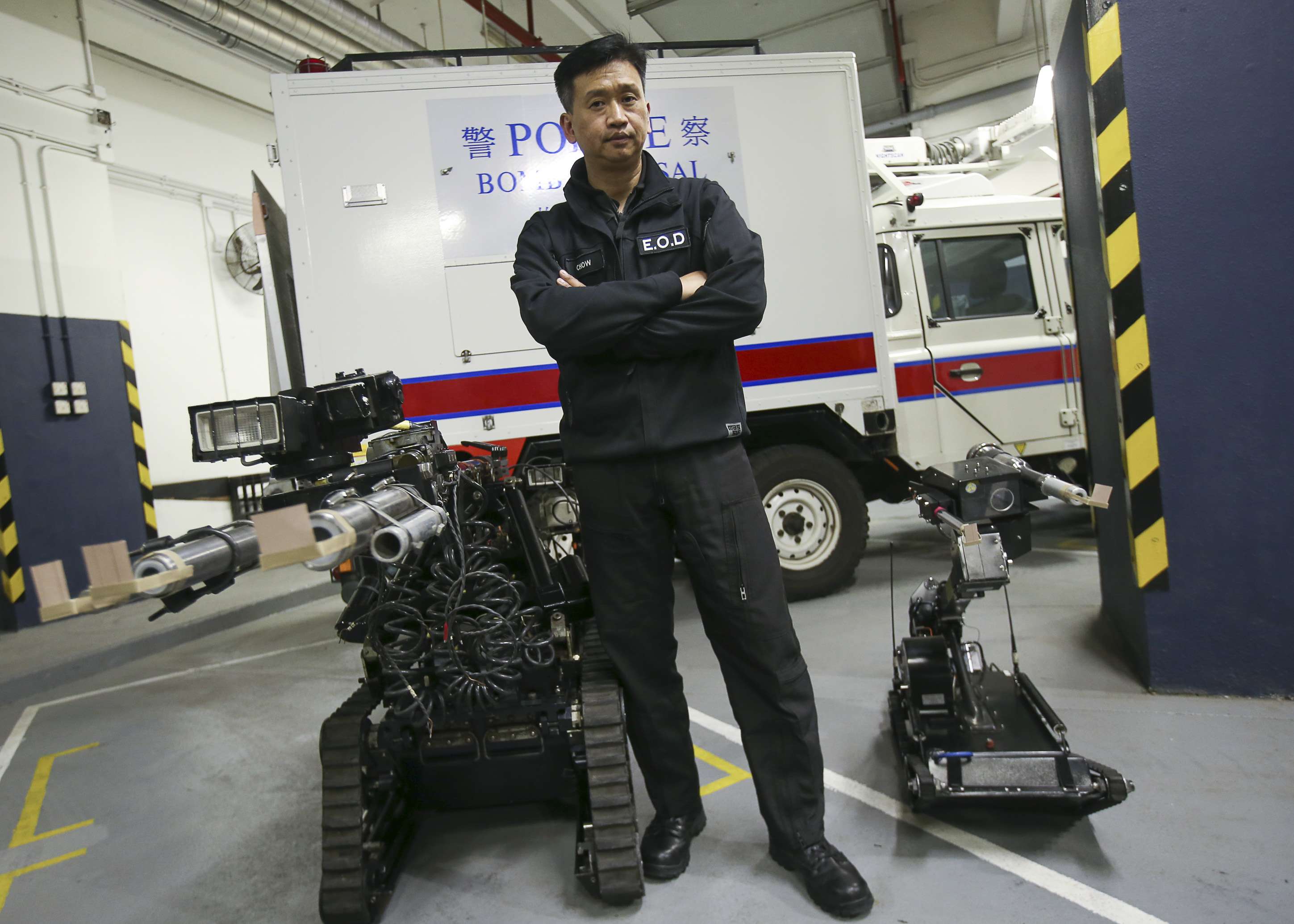 Senior bomb disposal officer Tony Chow poses with some robotic equipment. Photo: David Wong