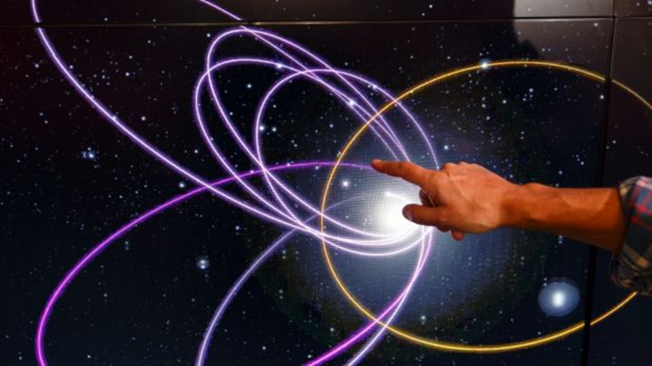 Mike Brown, professor of planetary astronomy at the California Institute of Technology, points to the gold ring showing a potential orbital path of planet nine in relation to the orbits of 'Trans-Neptunian Objects'. Photo: Patrick T. Fallon/The Washington Post