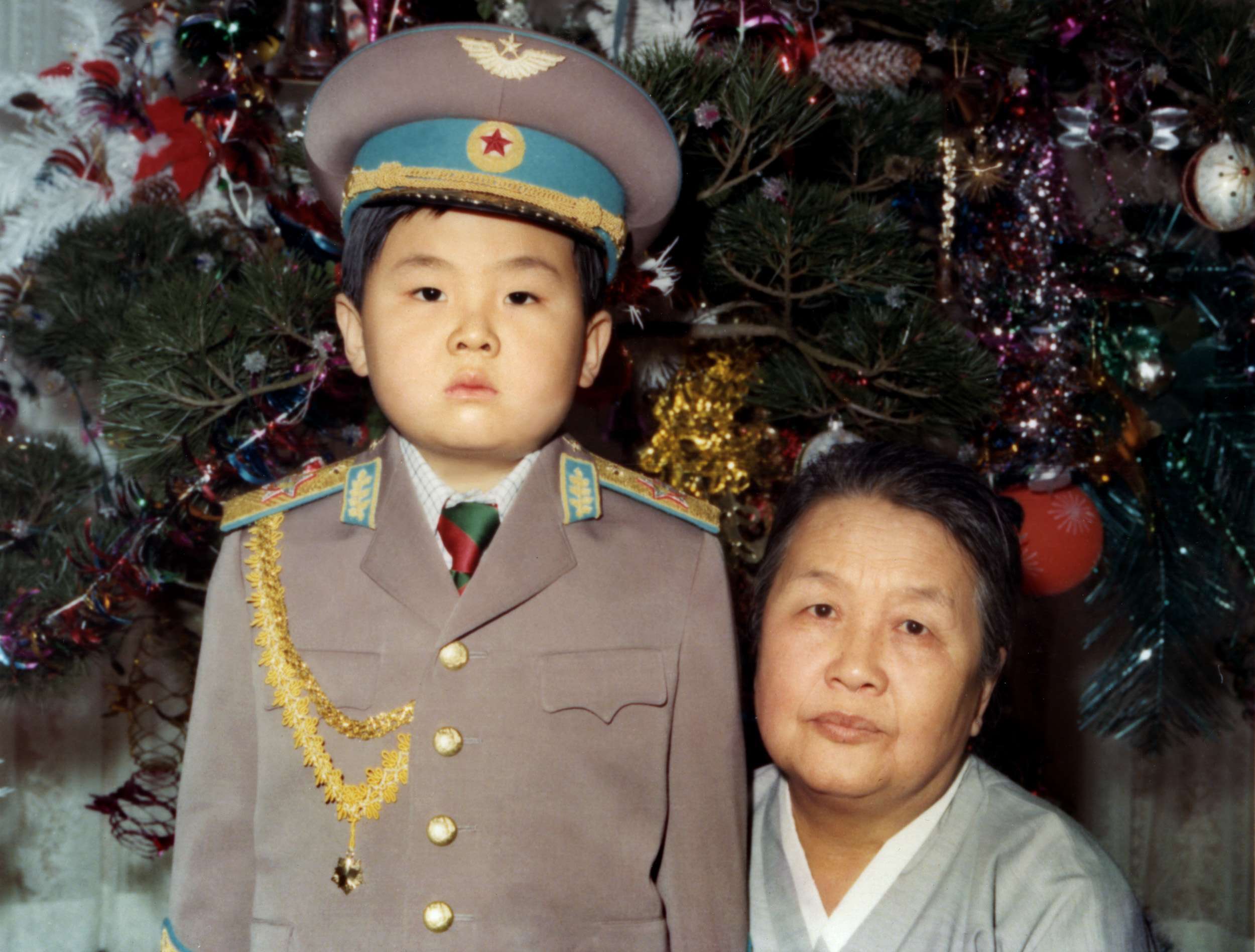 Kim Jong-nam dressed in an army uniform with his maternal grandmother in January 1975. Picture: AFP
