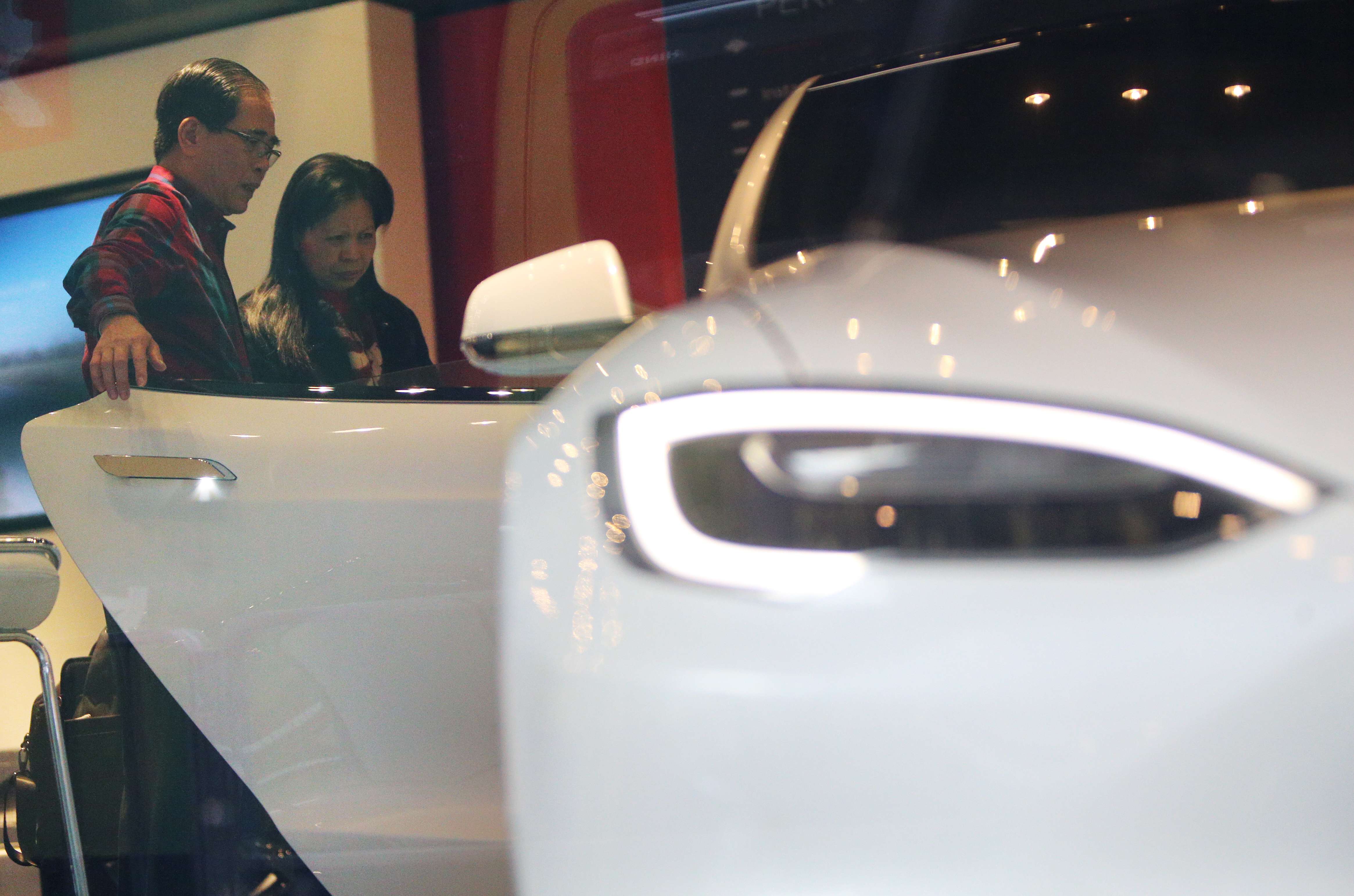 Potential buyers visit the showroom of electric carmaker Tesla in Wan Chai. Photo: Dickson Lee