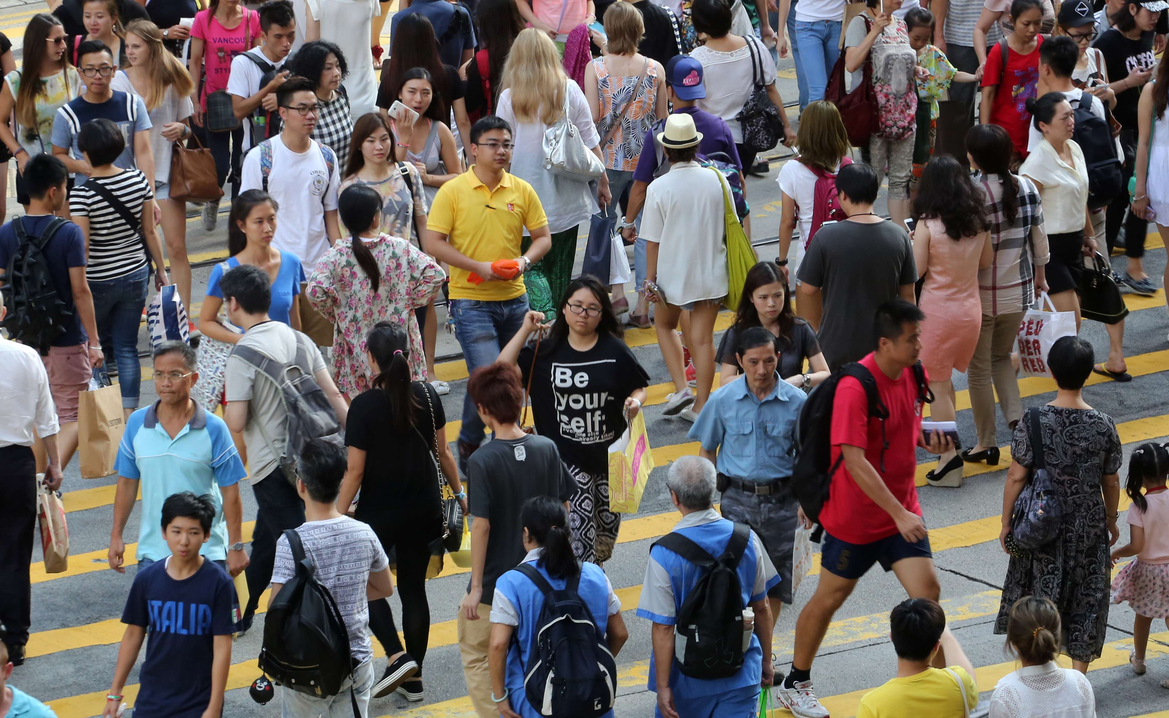 Pedestrians in a busy shopping area of Causeway Bay. Photo: Felix Area