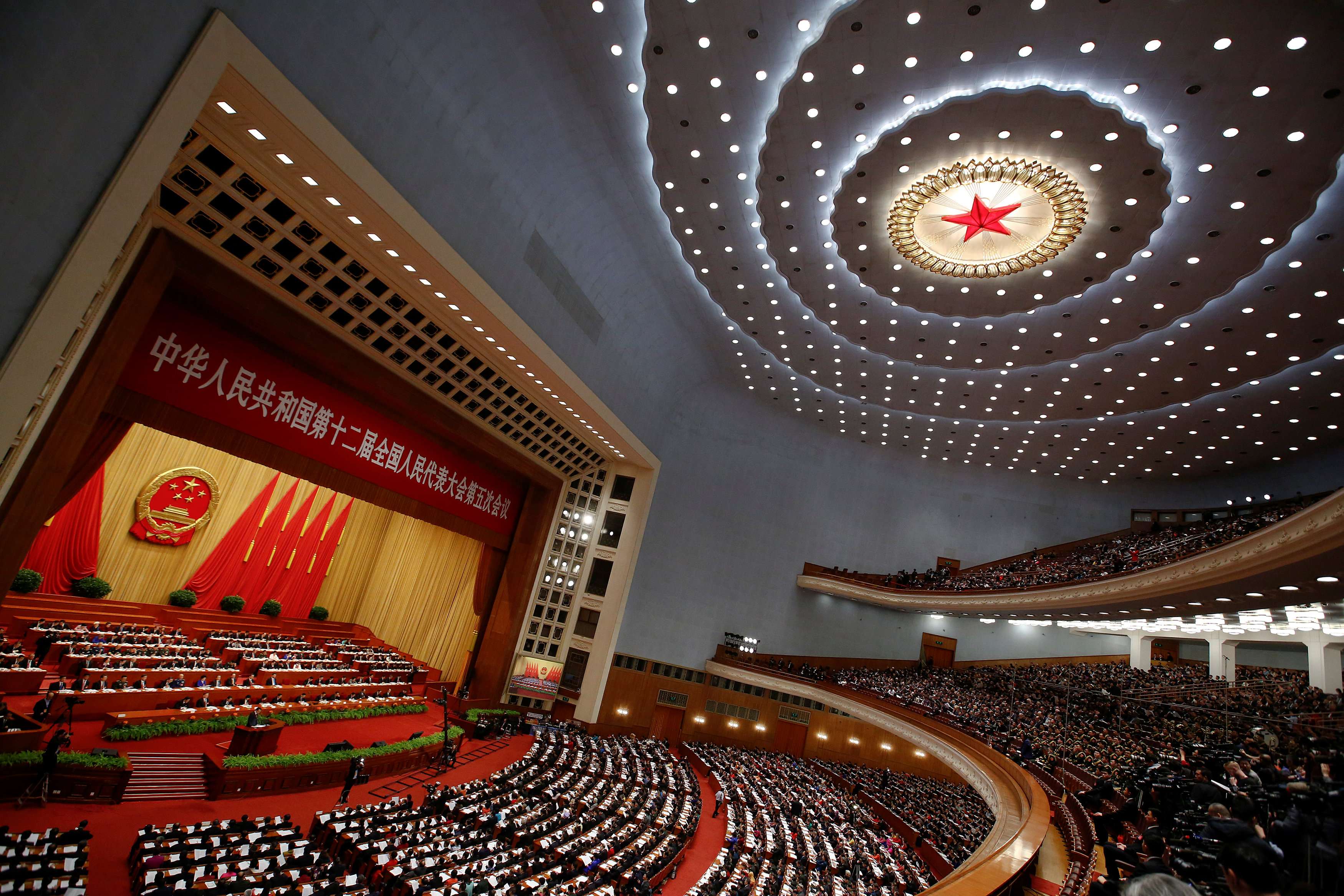 China's Premier Li Keqiang speaks during the opening session of the National People's Congress at the Great Hall of the People in Beijing on Sunday. Photo: Reuters