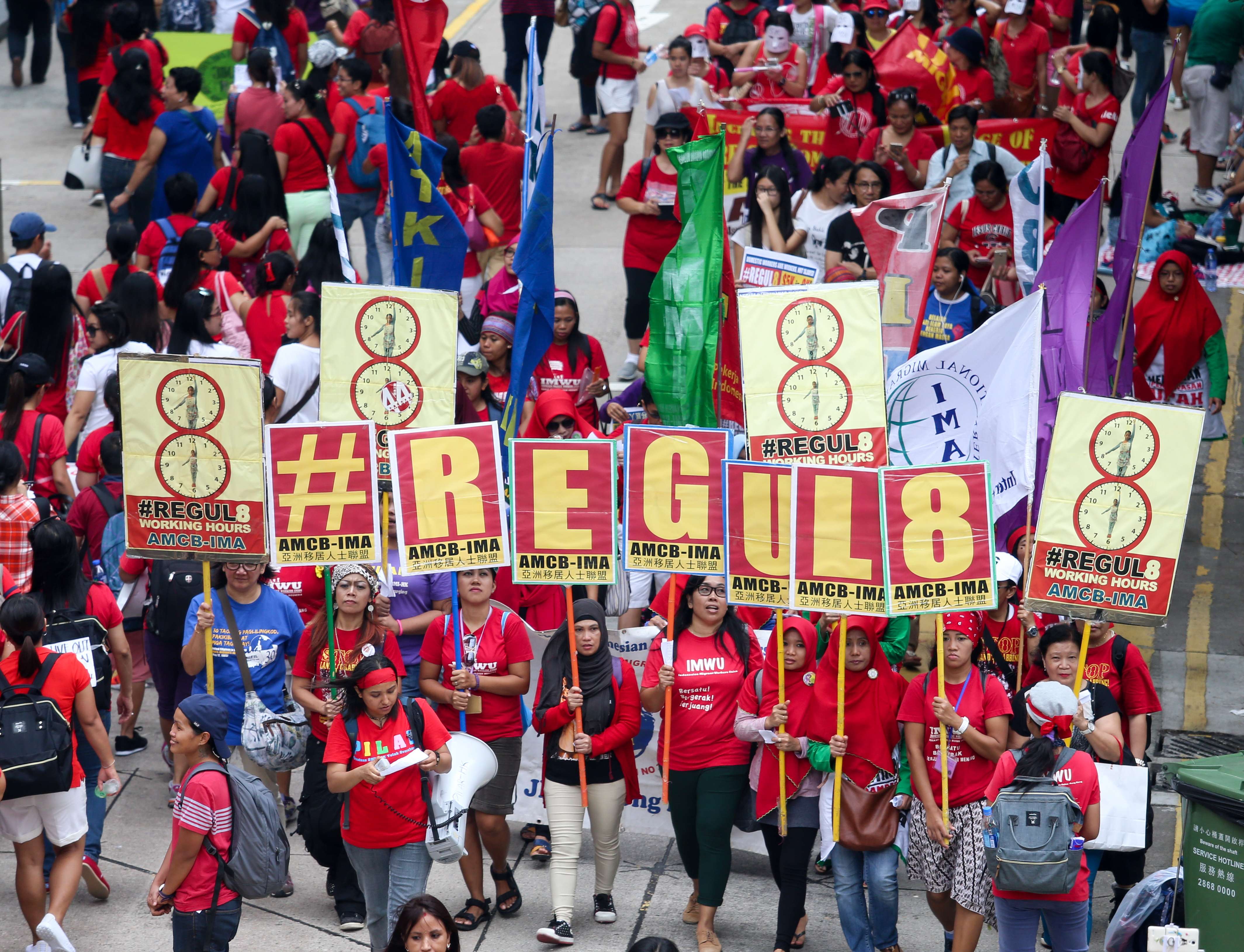 Members of the Asian Migrants’ Coordinating Body march for better pay, in Central last September. Photo: K. Y. Cheng