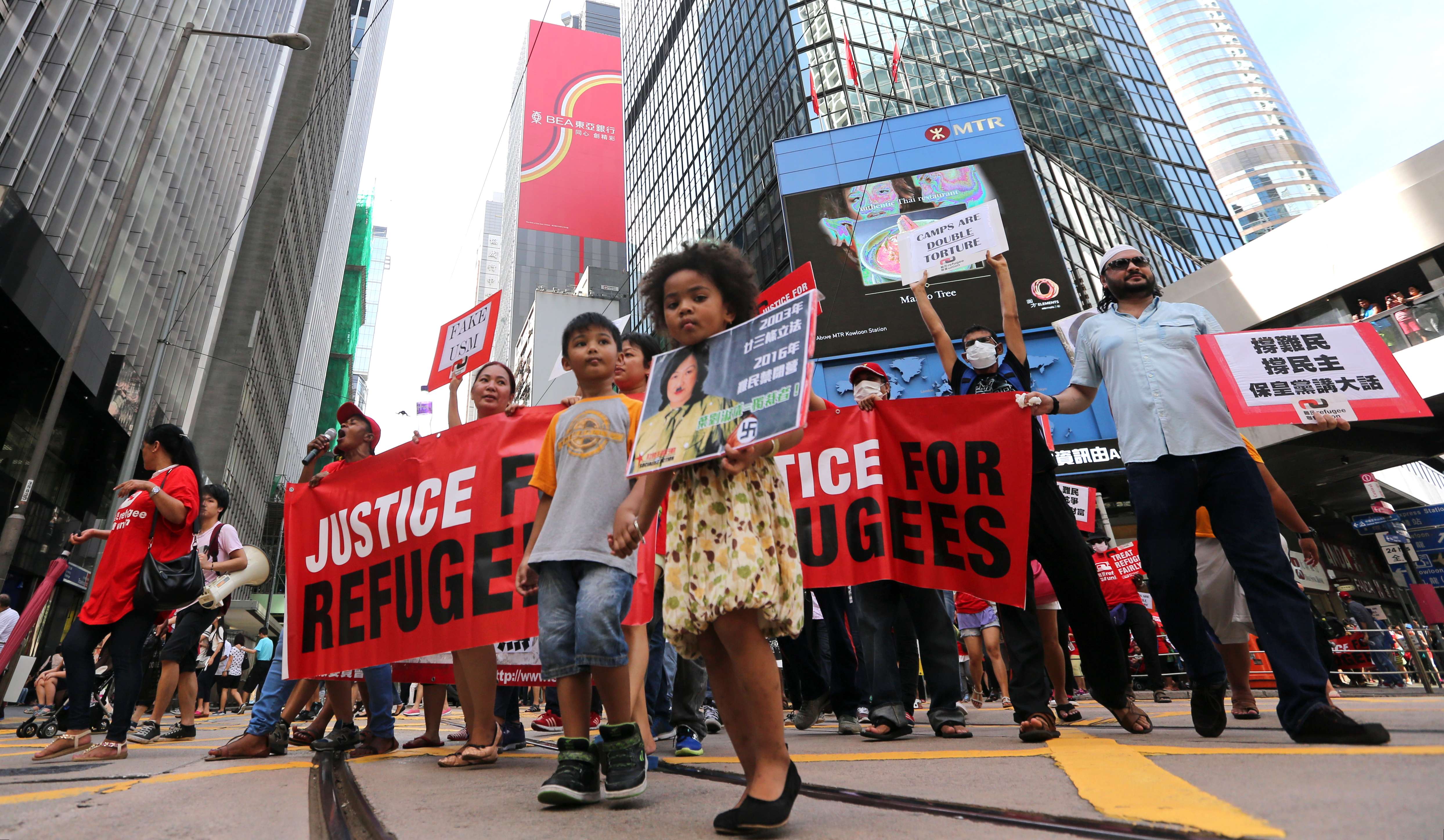 Children take part in a rally to mark World Refugee Day, in Central last June 20. The US used to be the predominant country of resettlement for the handful of successful asylum seekers in Hong Kong, but President Donald Trump’s order could change that. Photo: Edward Wong