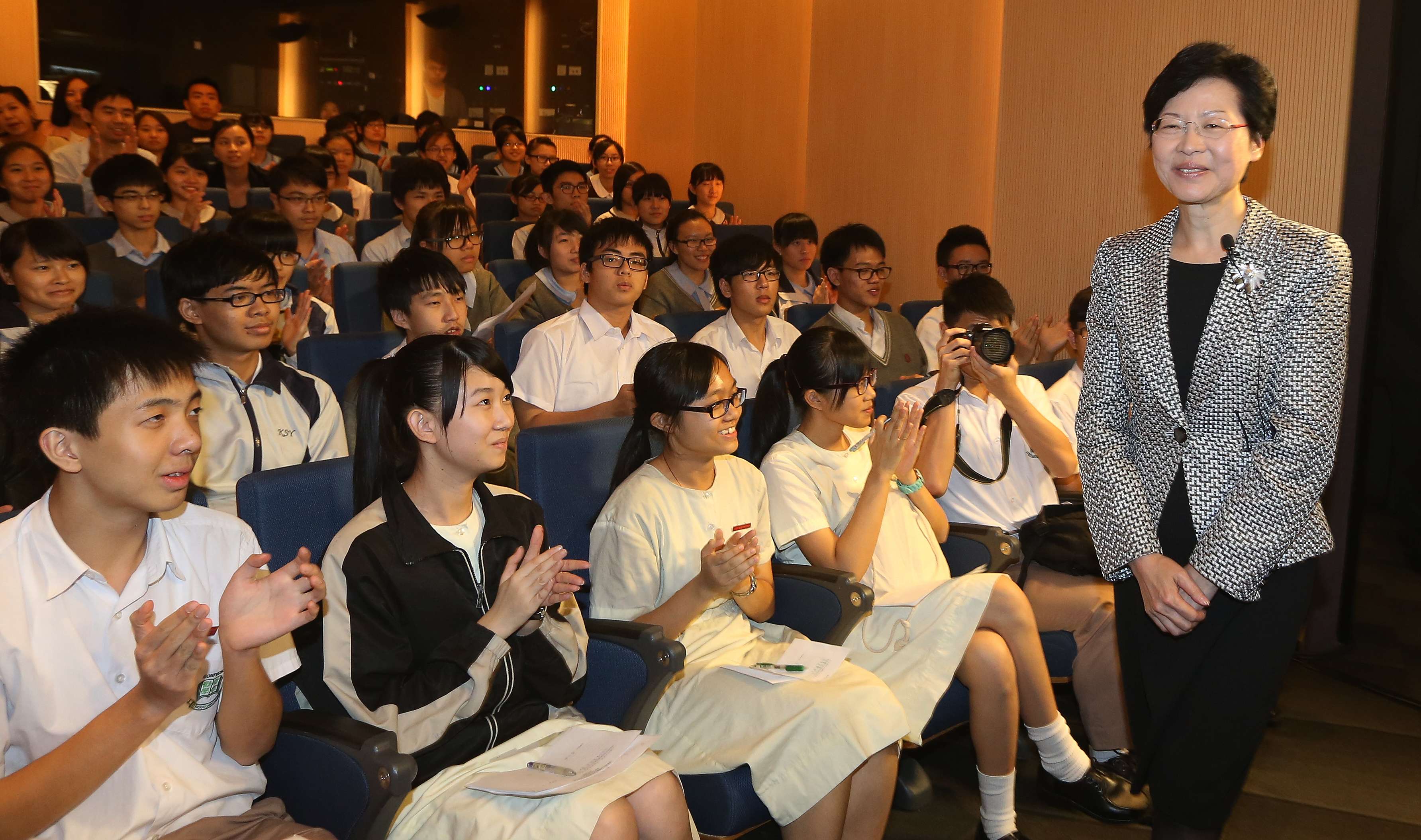 Then chief secretary Carrie Lam attends a forum with teenagers to discuss issues related to poverty, in Aberdeen in 2013. Photo: Sam Tsang