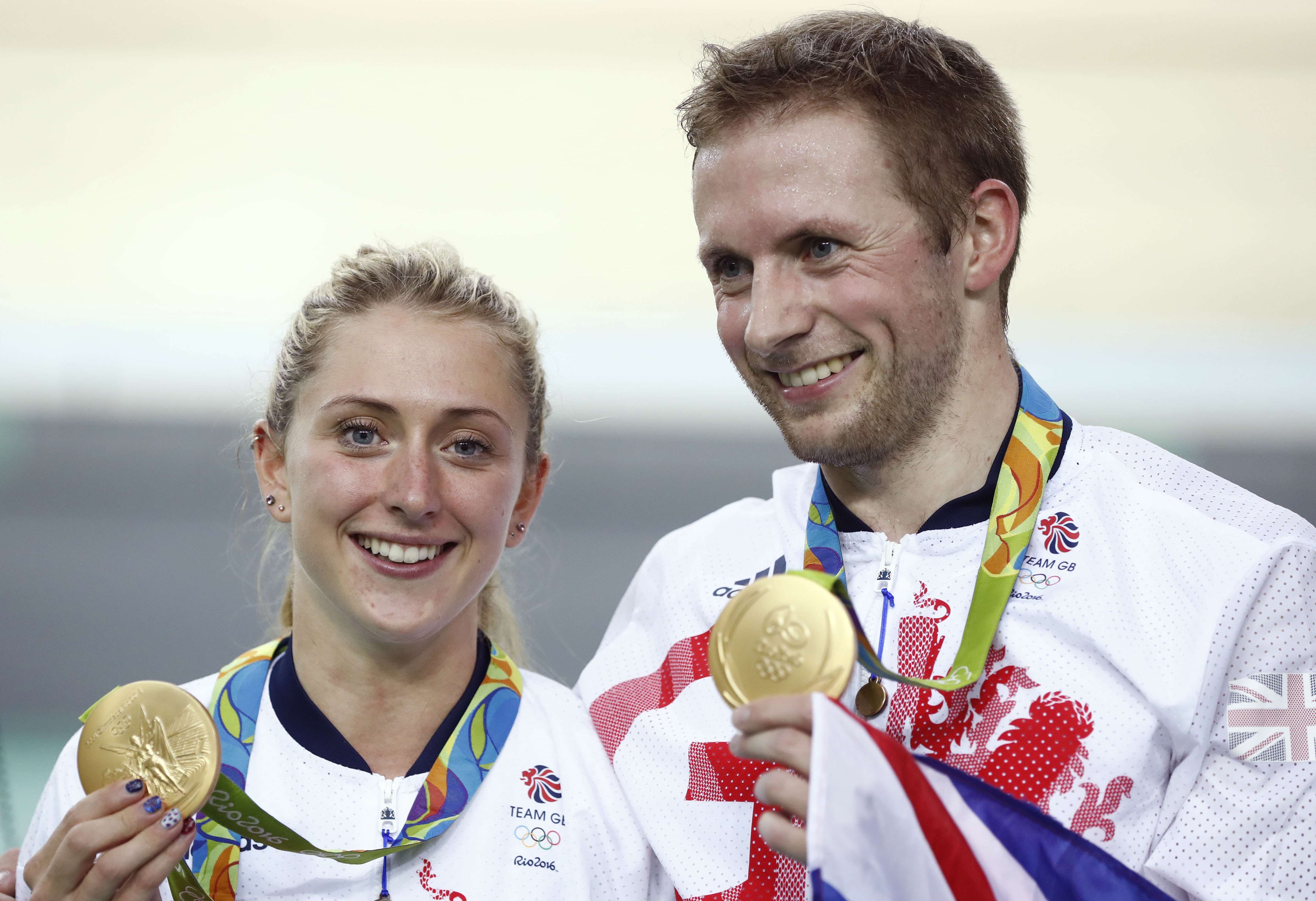 Gold medallist Britain's Jason Kenny poses next to his then-fiancee Laura Trott at the Rio Olympics. His wife is now expecting their first child. Photo: AFP