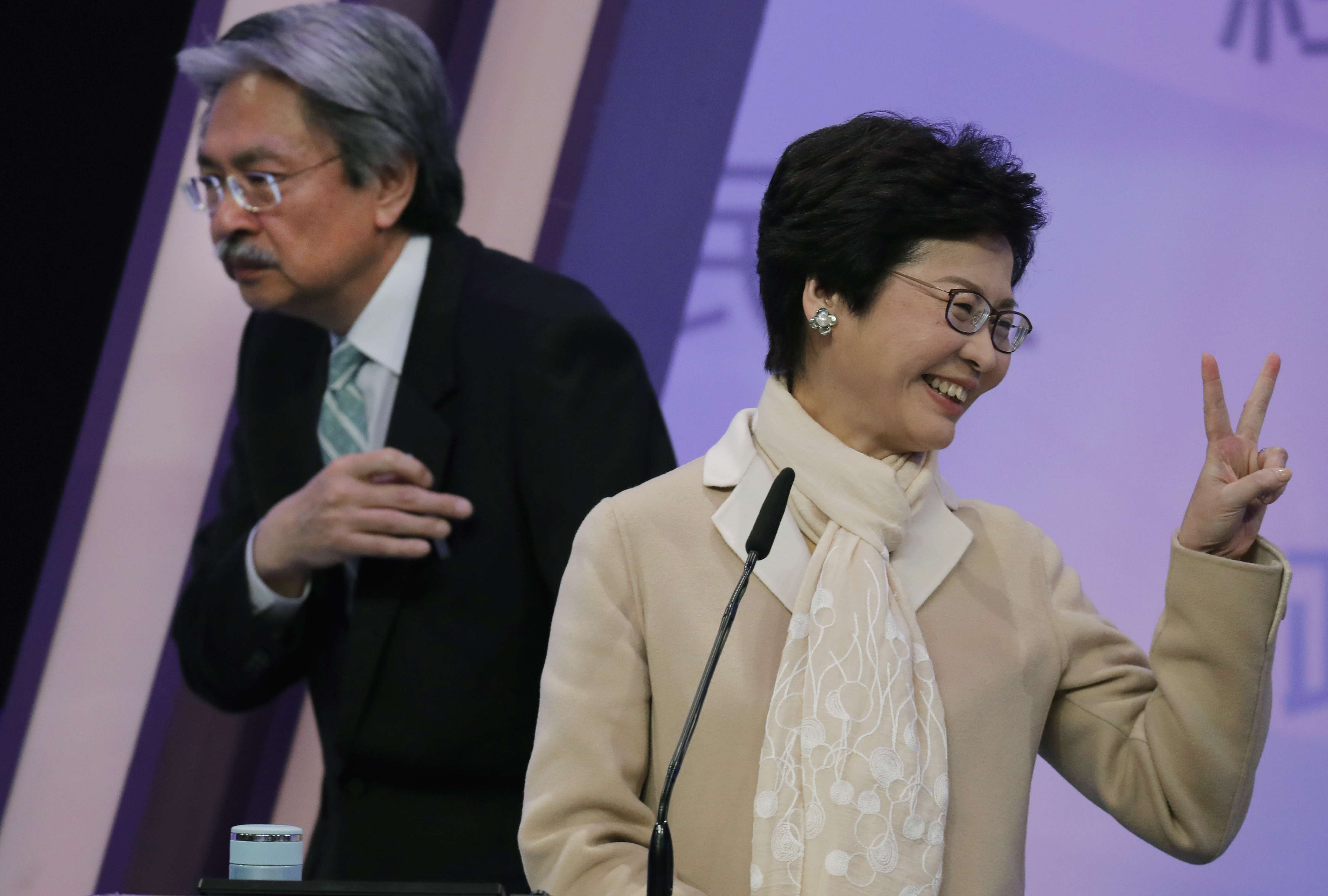Rival candidates John Tsang and Carrie Lam at an election debate on March 14, with less than two weeks to go before a 1,194-member committee makes its choice among three hopefuls, the third being retired judge Woo Kwok-hing. Photo: AP