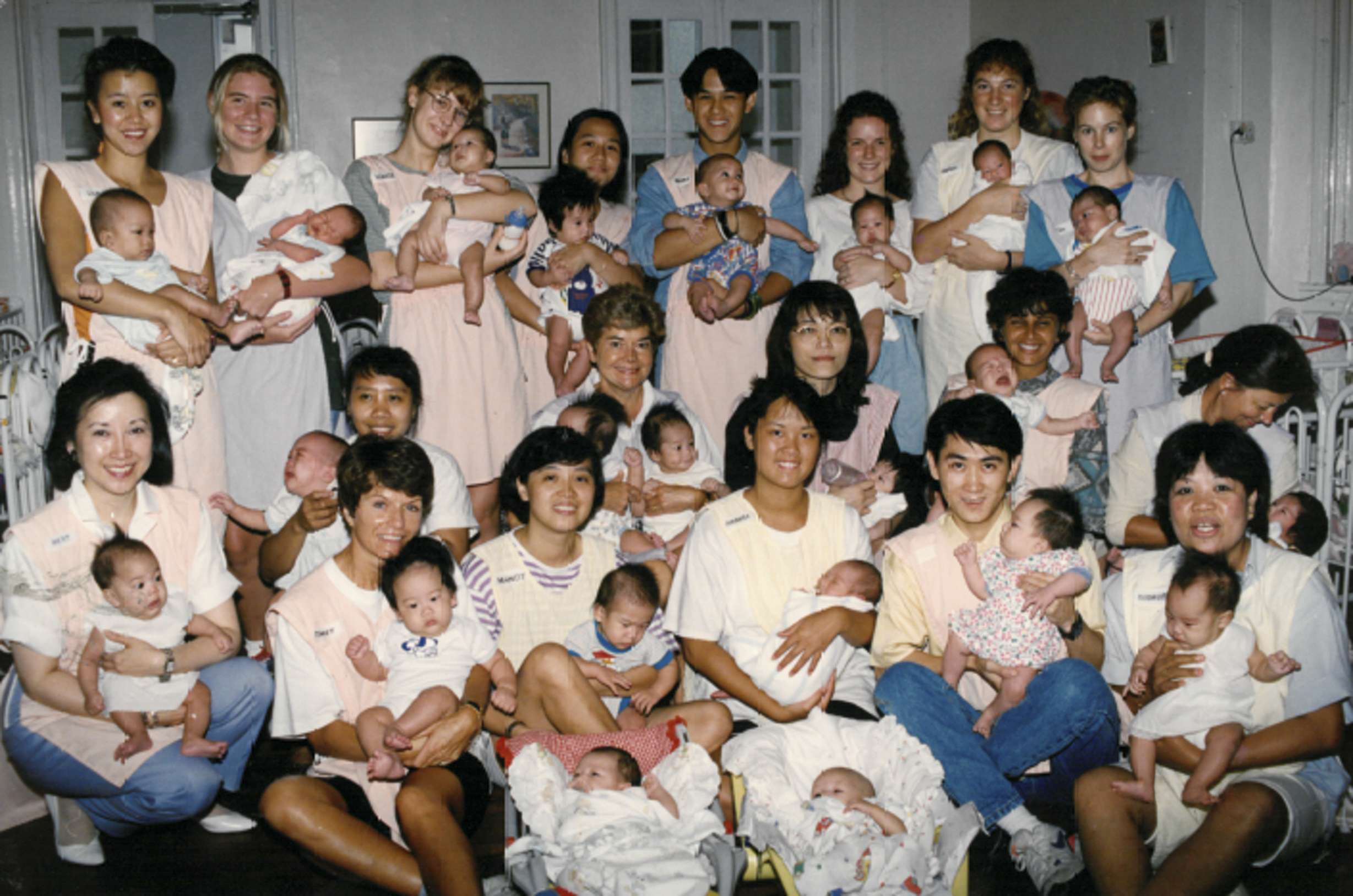 One of the earliest teams of child care home volunteers in their pink striped aprons in 1993. Photo: Courtesy of Mother’s Choice