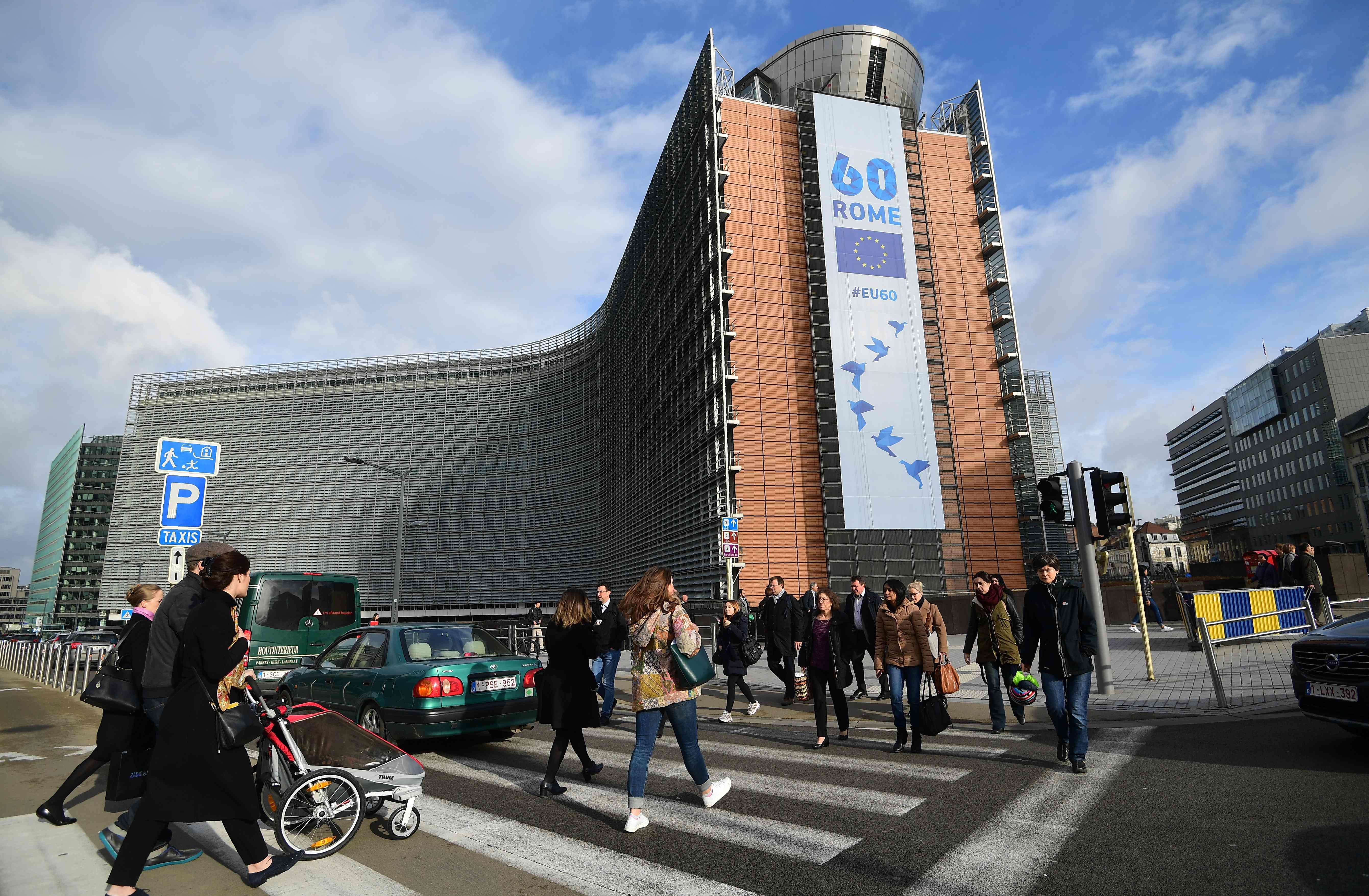 A banner celebrates 60 years of the Treaties of Rome, at the European Commission in Brussels, on March 21. European Union leaders and presidents of EU institutions will come together in Rome on March 25 to commemorate the twin treaties that laid the foundation for the EU. Photo: AFP