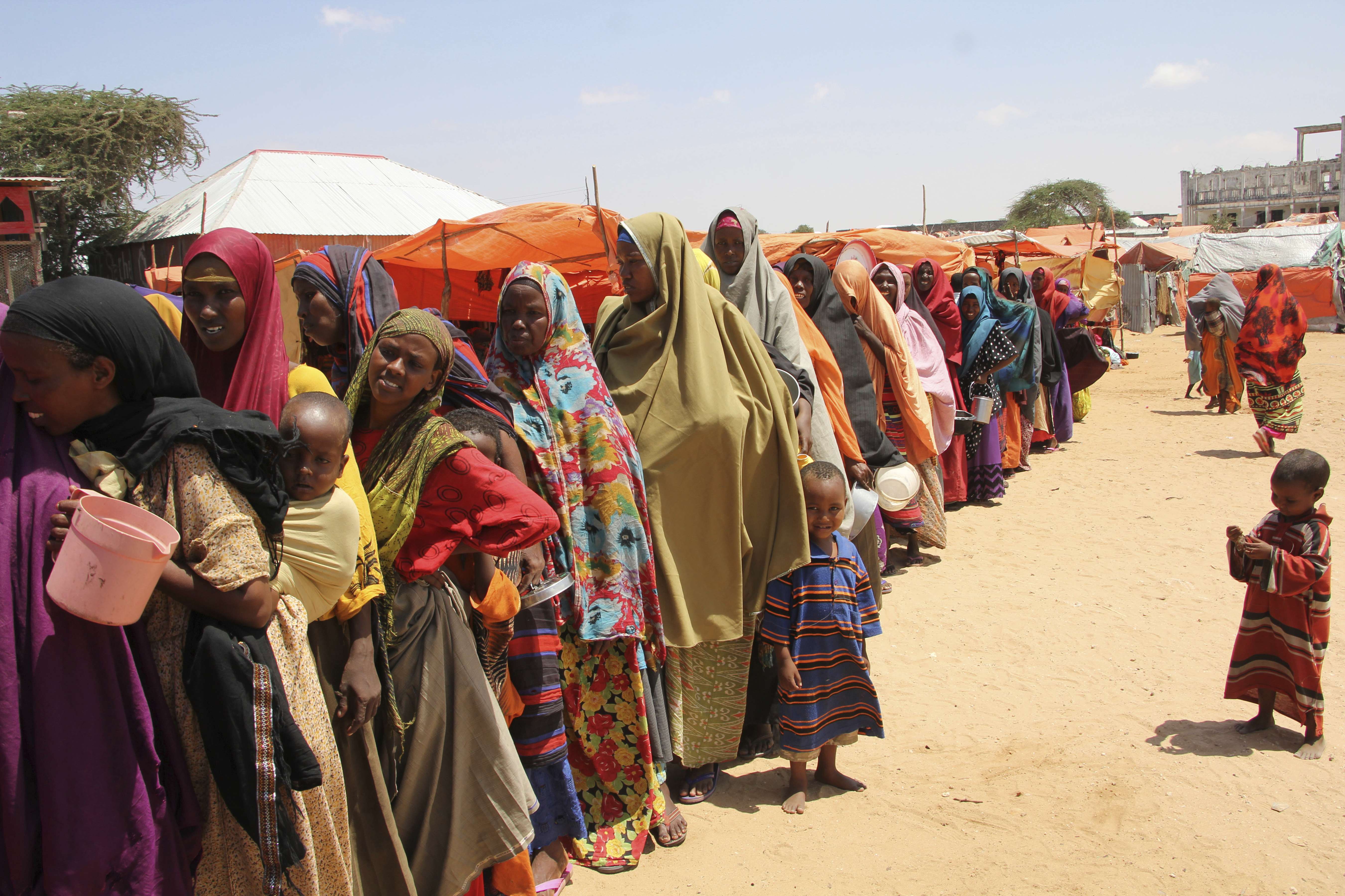Displaced Somali women queue for food handouts in a camp outside Mogadishu, the capital of Somalia, on March, 27. Somalia's drought is threatening 3 million lives, the UN says, and aid agencies are calling for more urgent support to prevent the crisis from worsening. Photo: AP