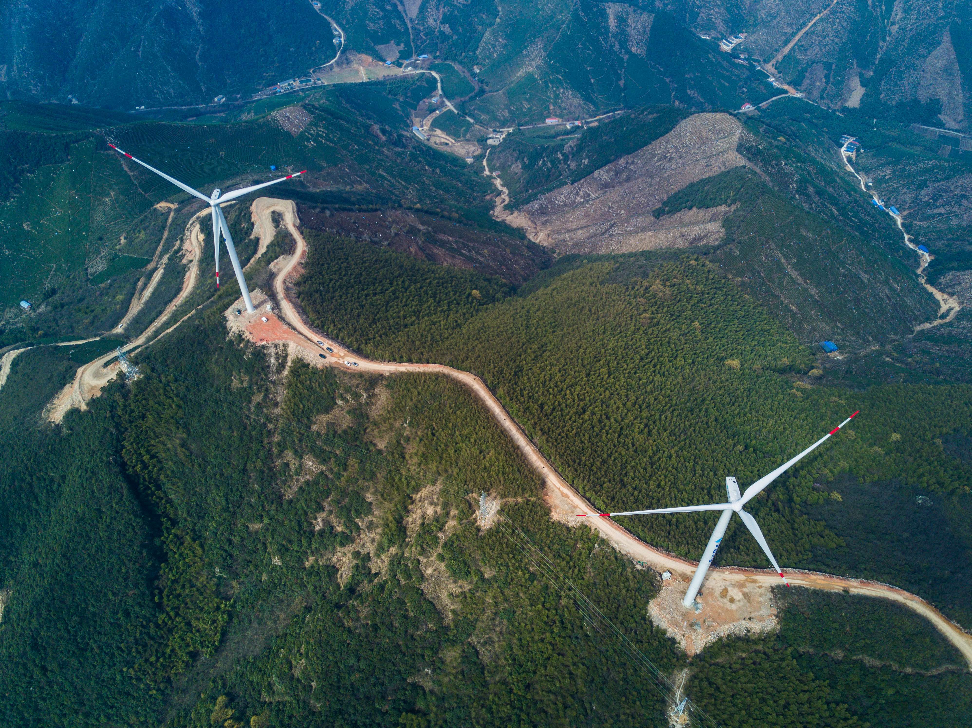 Wind turbines on the hills of Changxing county, Zhejiang province. The world’s second-biggest economy is evolving into the undisputed global leader in the wind and solar sectors, via an unprecedented wave of investment in manufacturing, and technology research and development. Photo: Xinhua