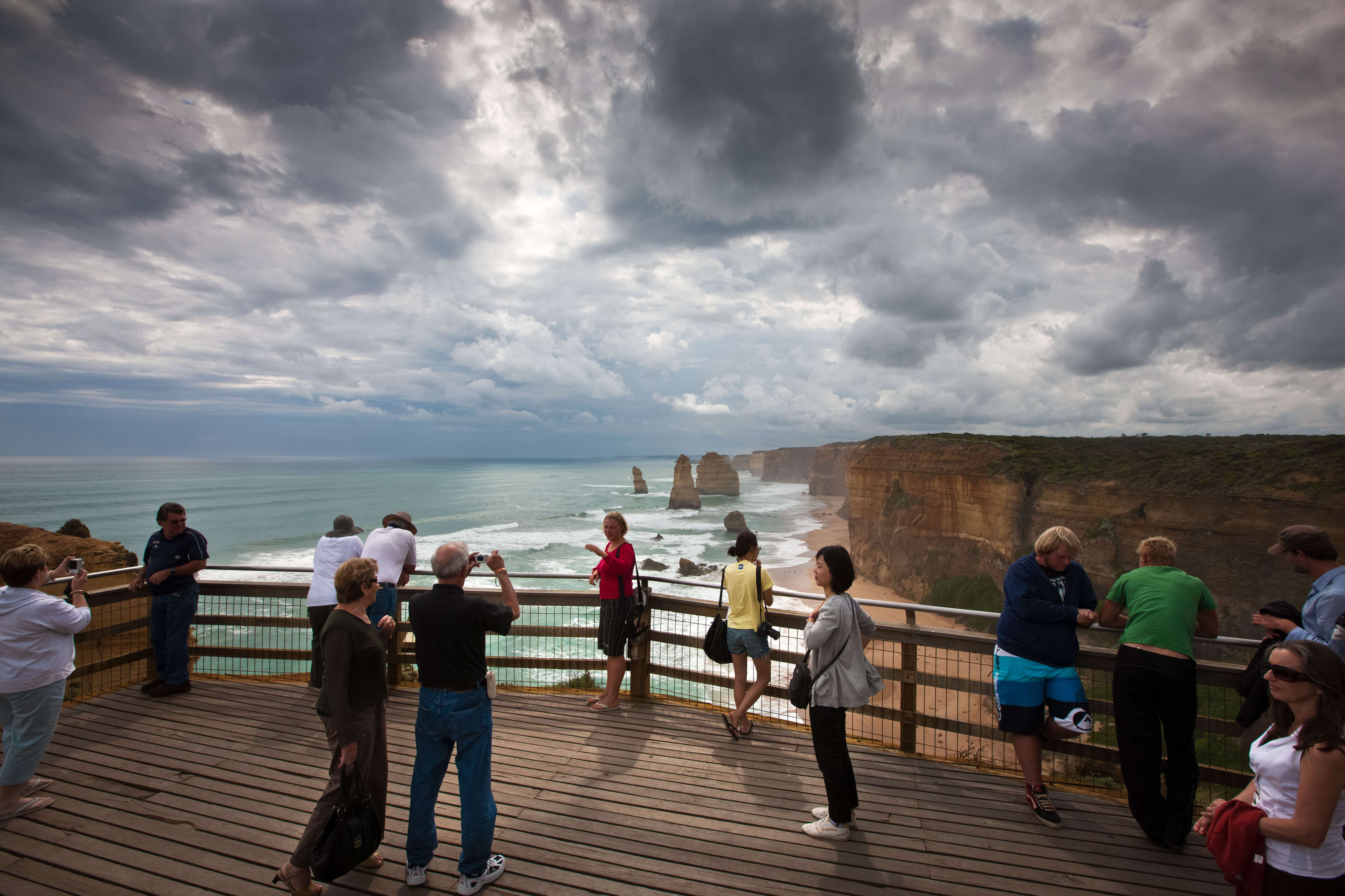 Tourists on a board walk at the Twelve Apostles in South West Victoria, the most famous sight on Australia’s Great Ocean Road. Photo: Alamy