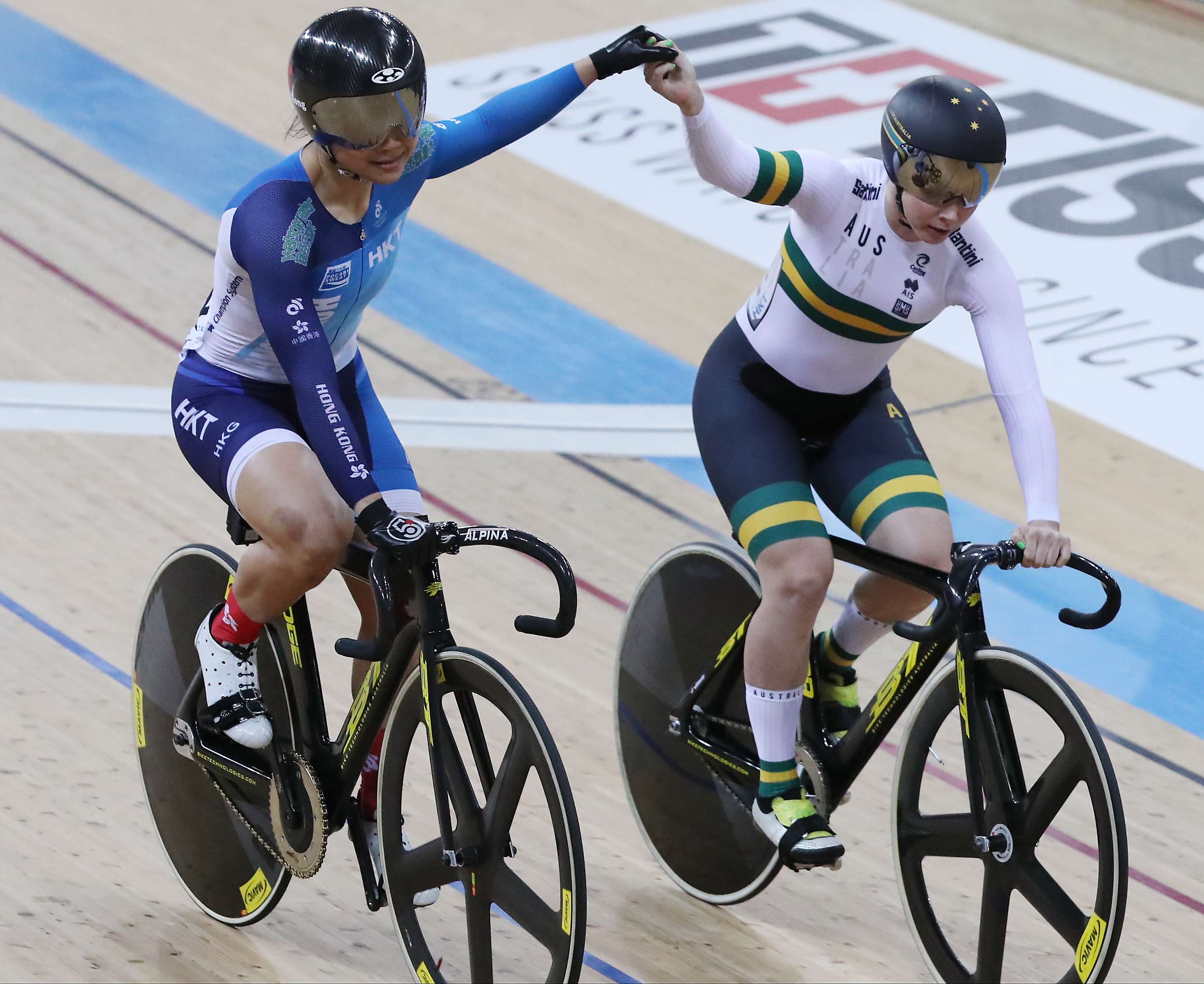 Hong Kong's Sarah Lee in a sporting gesture with Australia’s Kaarle McCulloch, after beating McCulloch in the quarter-finals of the women’s sprint at the Track Cycling World Championships. Photo: Edward Wong