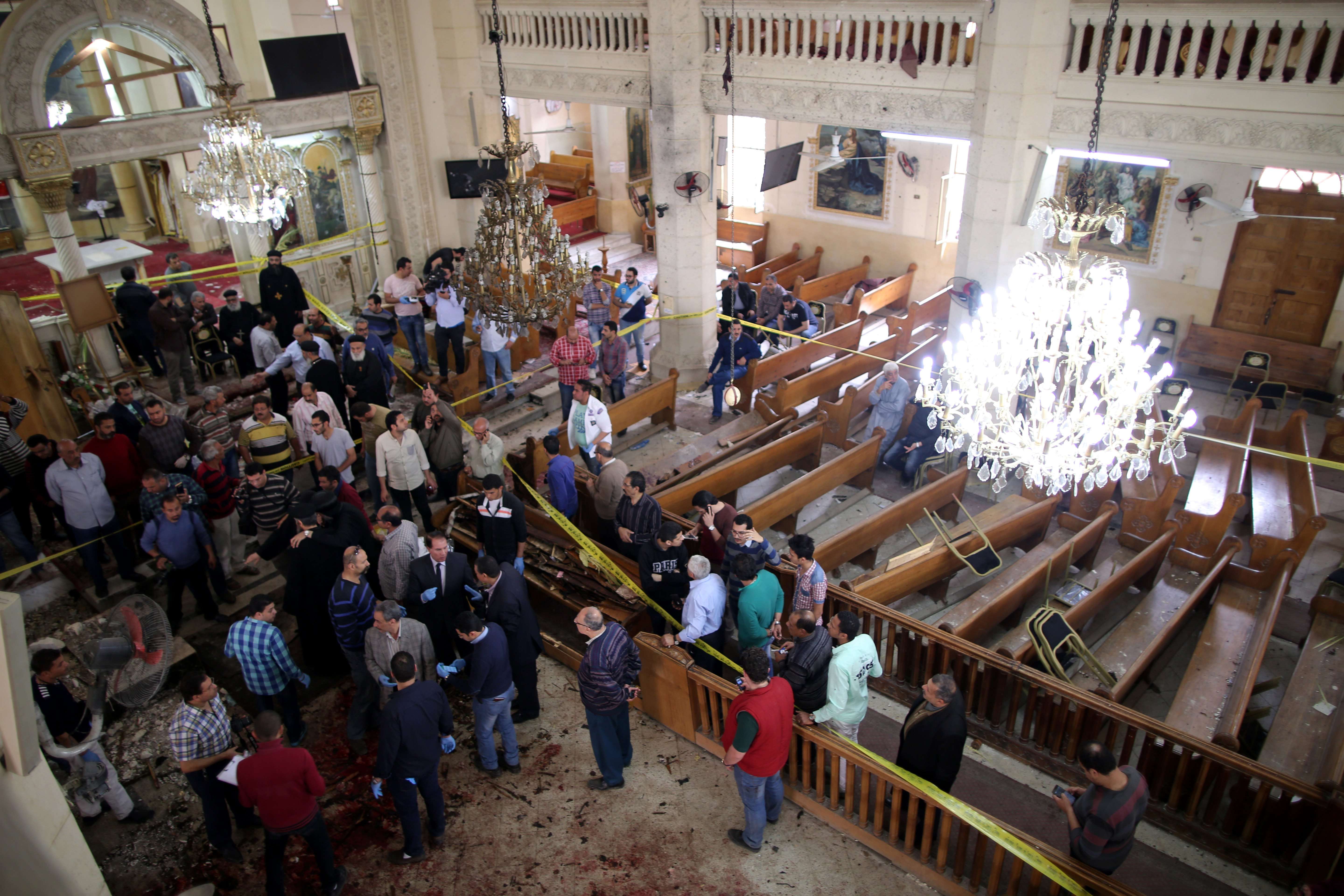 Security personnel investigate the scene of a bomb explosion inside Mar Girgis church in Tanta, north of Cairo, Egypt. Photo: EPA