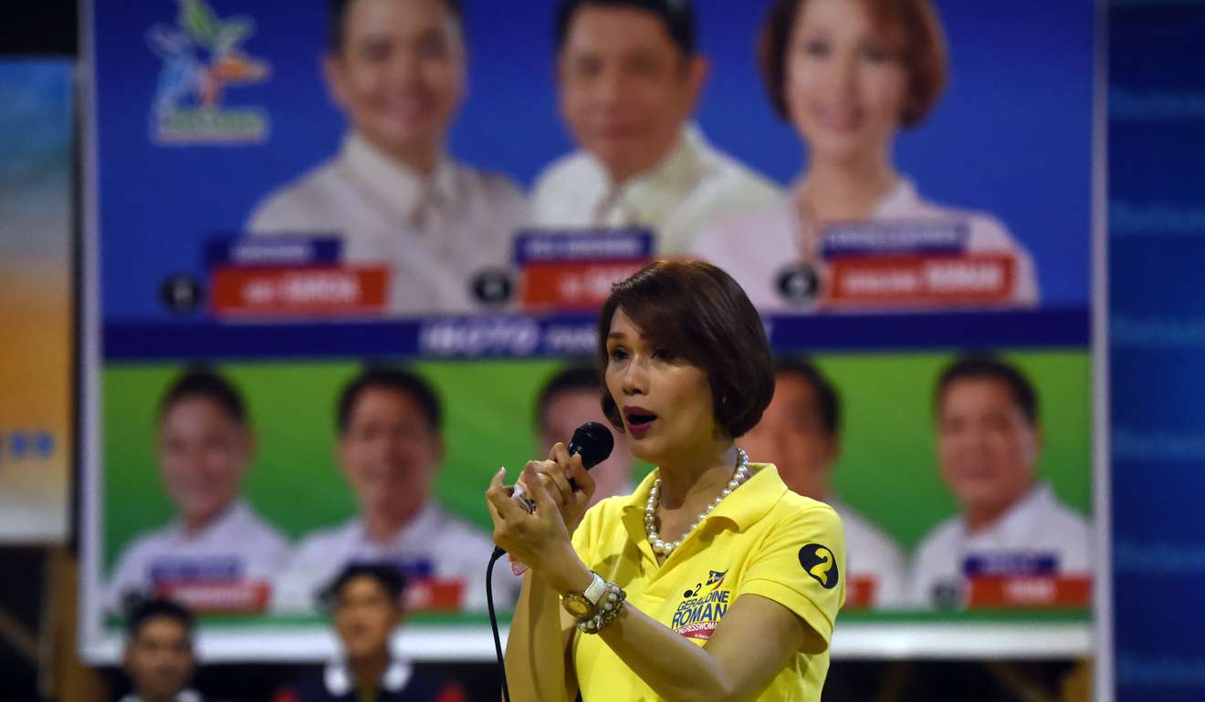 Transgender politician Geraldine Roman talks to supporters during a campaign trip to the town of Orani, Bataan province. Photo: AFP