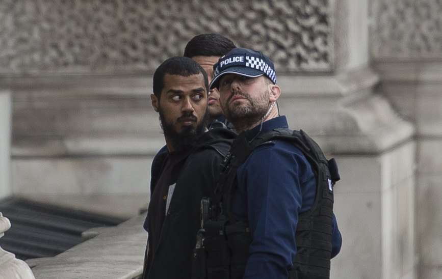 Police detain a man who was armed with knives near Westminster in Central London, on suspicion of plotting a possible terrorist attack. Photo: EPA