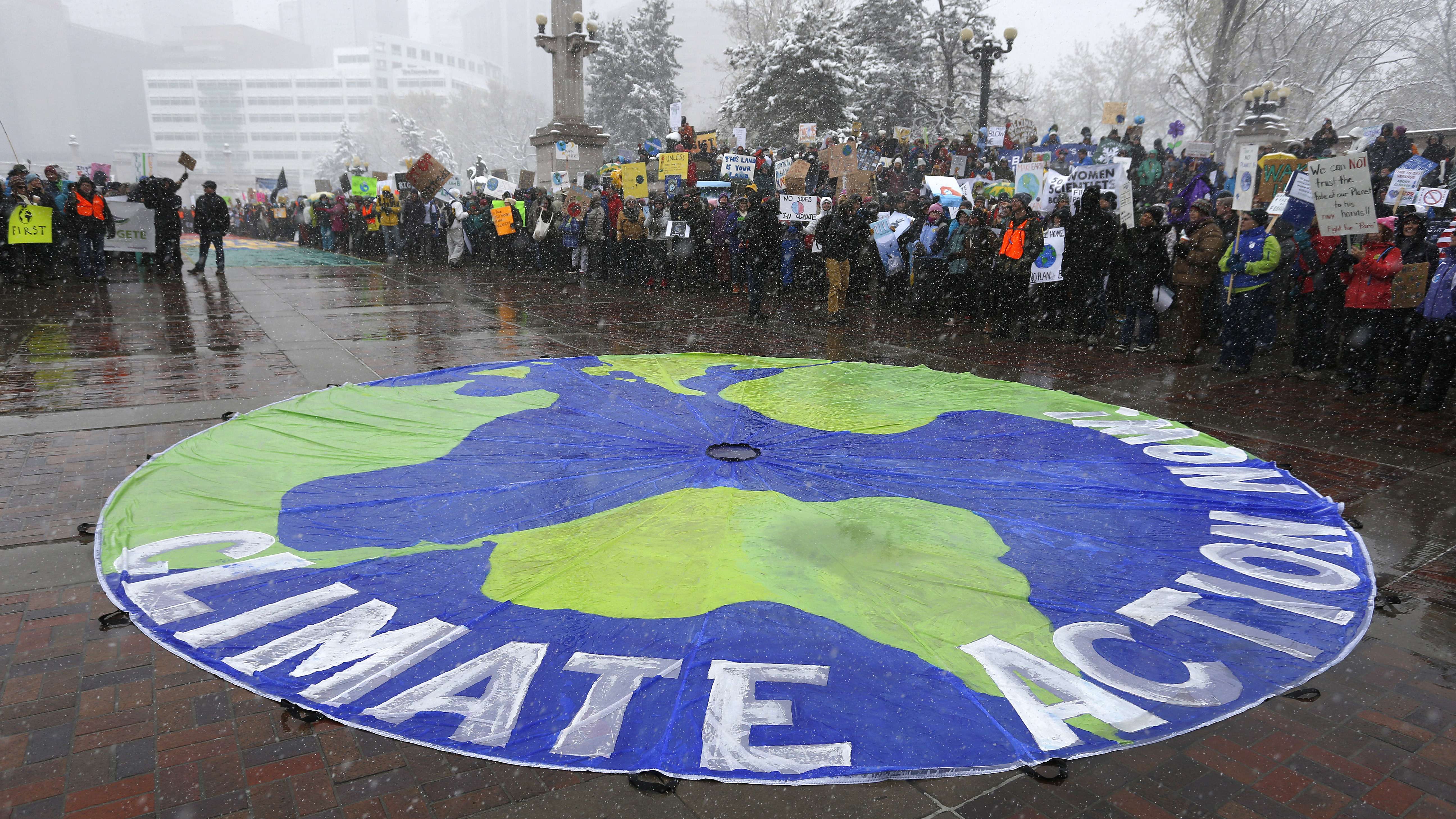 Participants chant during a climate change awareness rally, in Denver, Saturday, April 29, 2017. The gathering was among many others of its kind held nationwide marking President Donald Trump's 100th day in office. Photo: AP