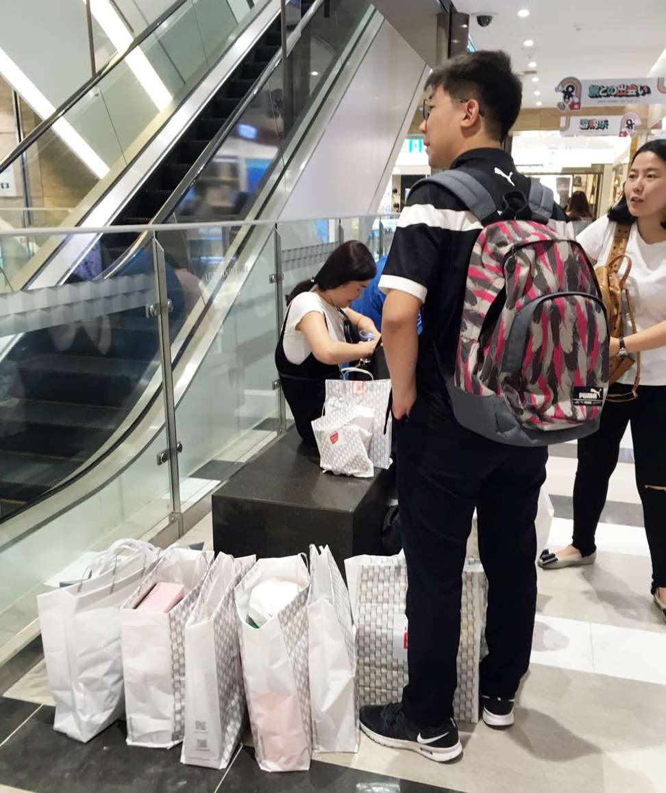 One shopper laden with goods in Jeju. Photo: SCMP Pictures
