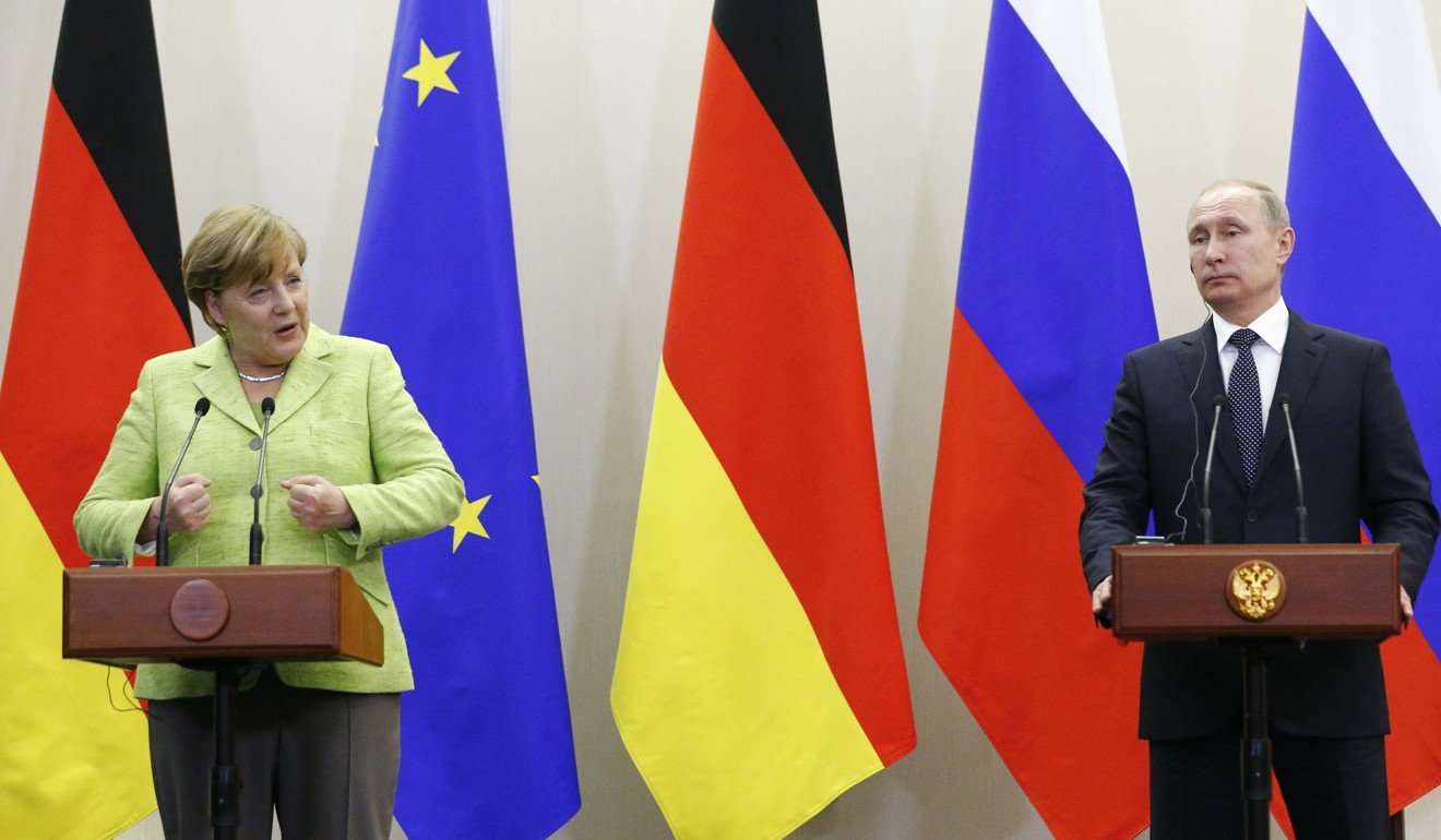 Russian President Vladimir Putin and German Chancellor Angela Merkel attend a joint news conference following their talks in Sochi. Photo: Reuters