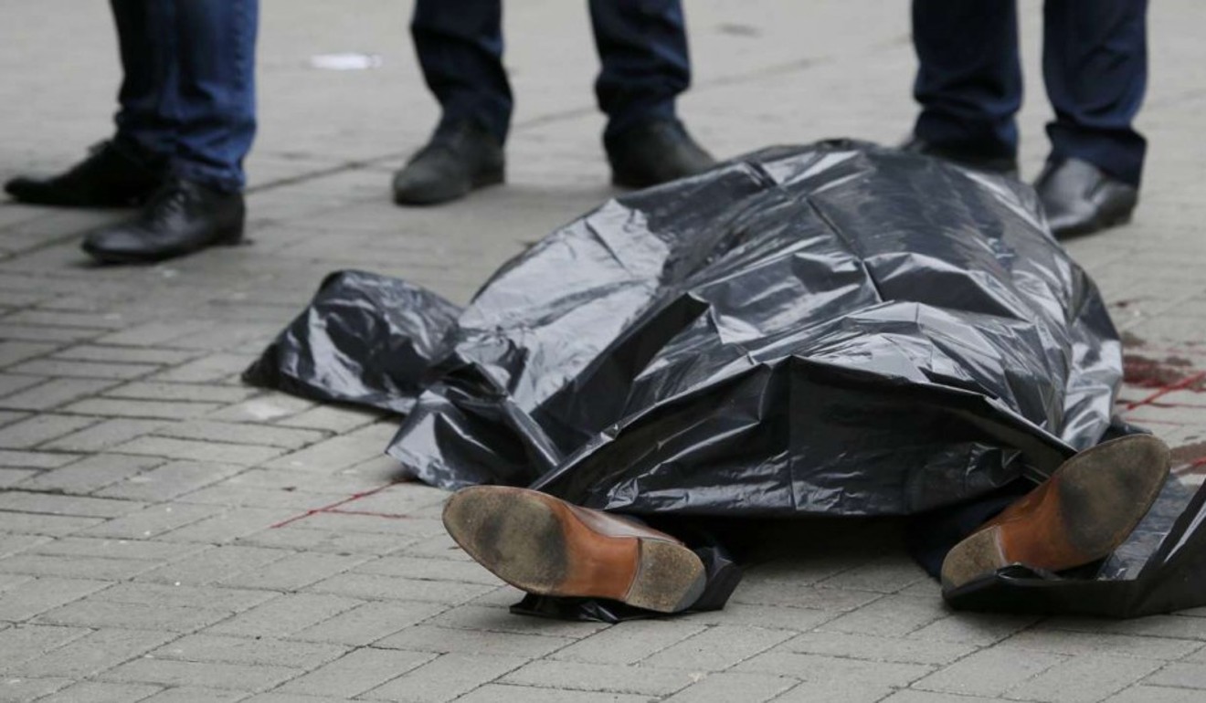 The body of Denis Voronenkov, a former lawmaker of the Russian State Duma, is seen in central Kiev, Ukraine, on Thursday, after his street assassination. Photo: Reuters