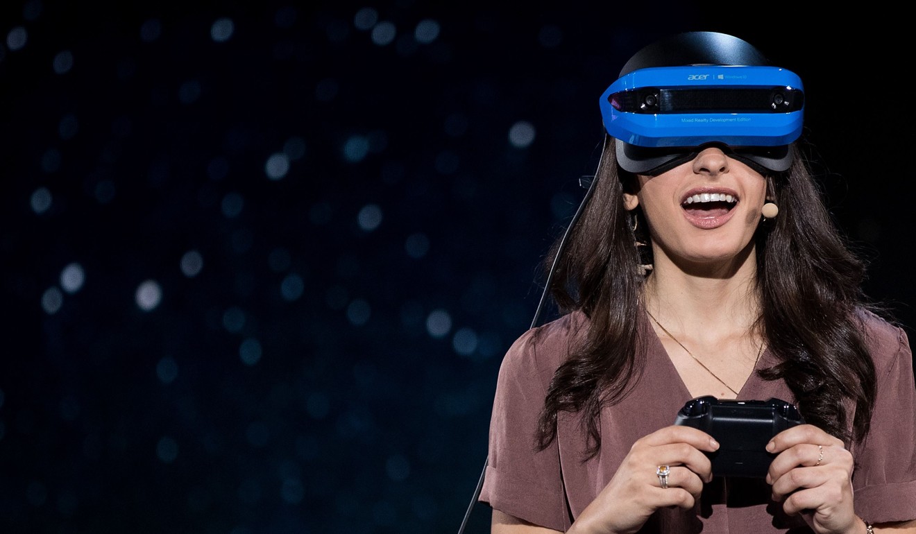 A Microsoft employee demonstrates an Acer Windows VR headset during a Microsoft launch event. Photo: AFP