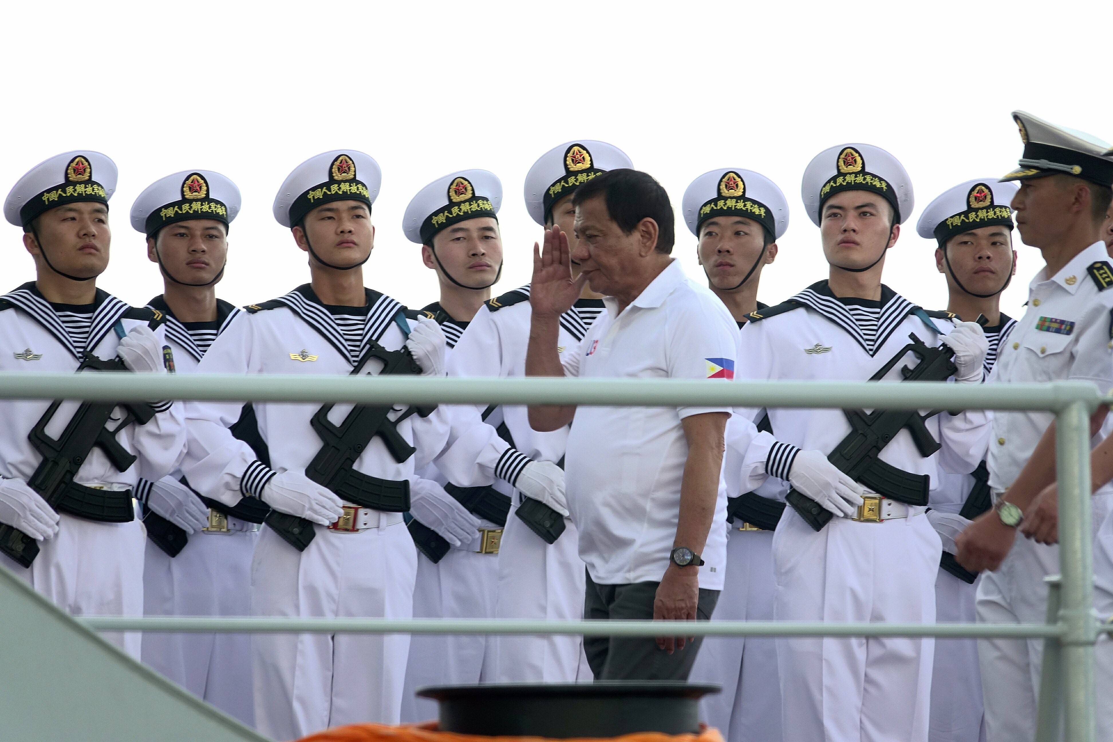 PLA Navy personnel are saluted by Philippines President Rodrigo Duterte as he tours a Chinese navy flotilla that docked in Davao City on a four-day goodwill visit, on May 1. Photo: EPA