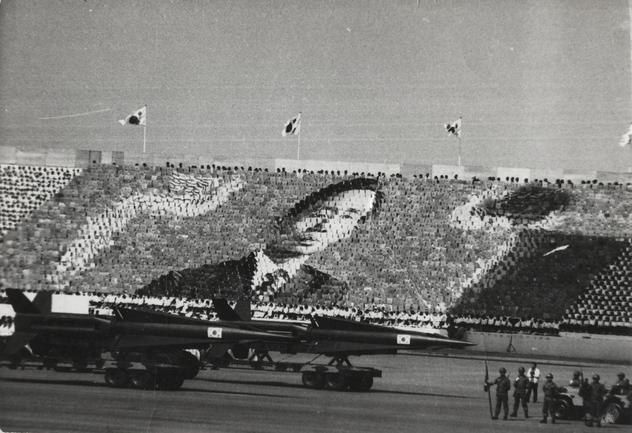 A South Korean military parade in 1973 honouring president Park Chung-hee, whose rigid, conservative nation serves as the stark backdrop in Everything Belongs to Us.