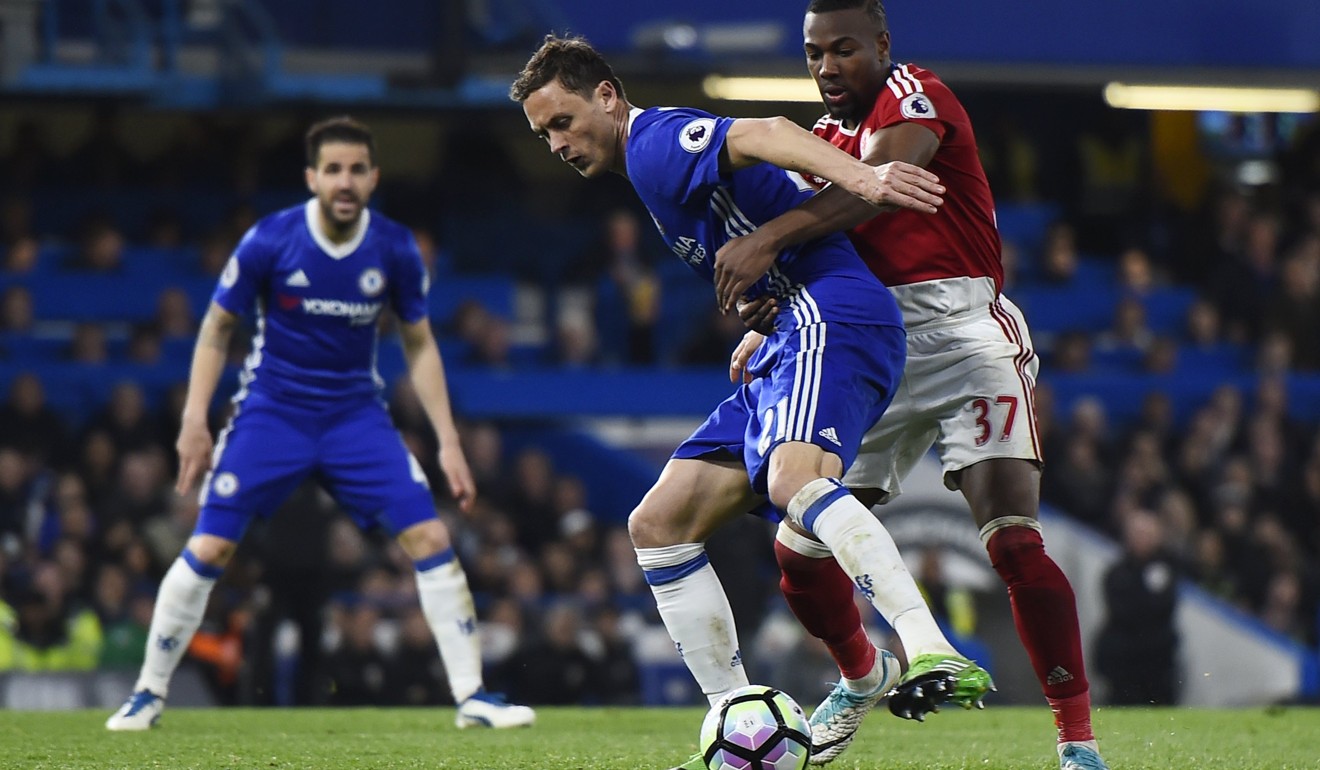 Chelsea's Nemanja Matic (2-R) vies for the ball against Middlesbrough's Adams Traore (R) during the English Premier League soccer match between Chelsea FC and Middlesborough FC. Chelsea won 3-0 and is now a win away from the English Premier League title. Photo: EPA