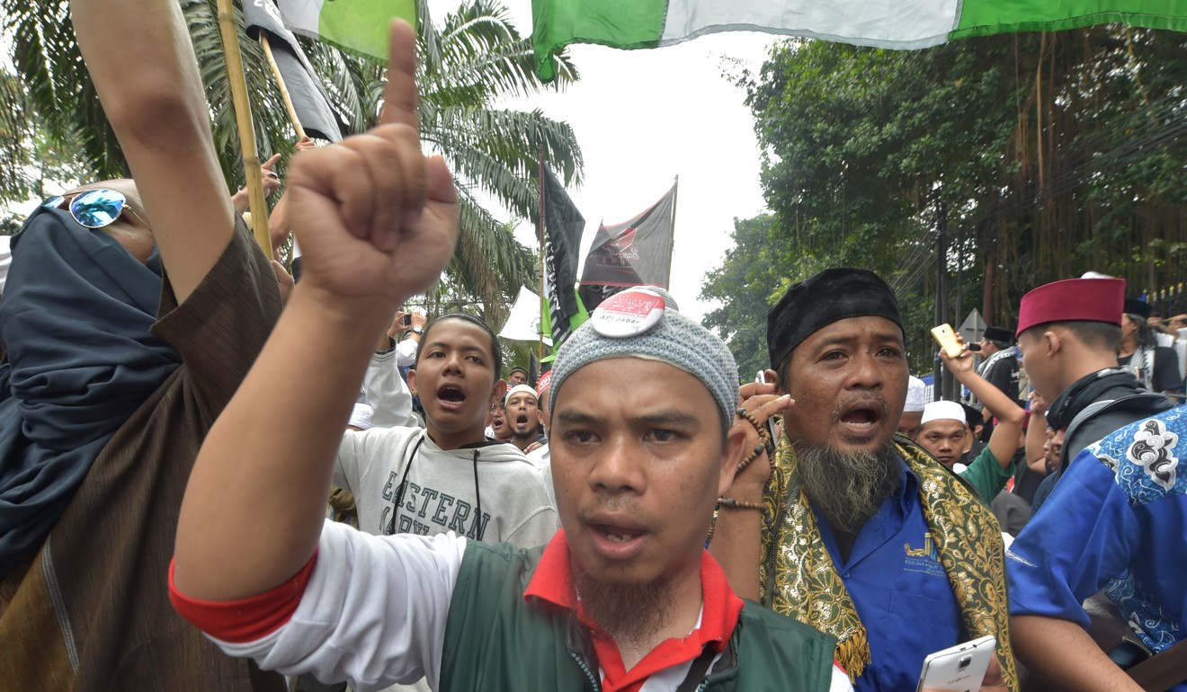 Indonesian protesters chant slogans against Jakarta governor Basuki Tjahaja Purnama, also know as Ahok, following his conviction for blasphemy. Photo: AFP